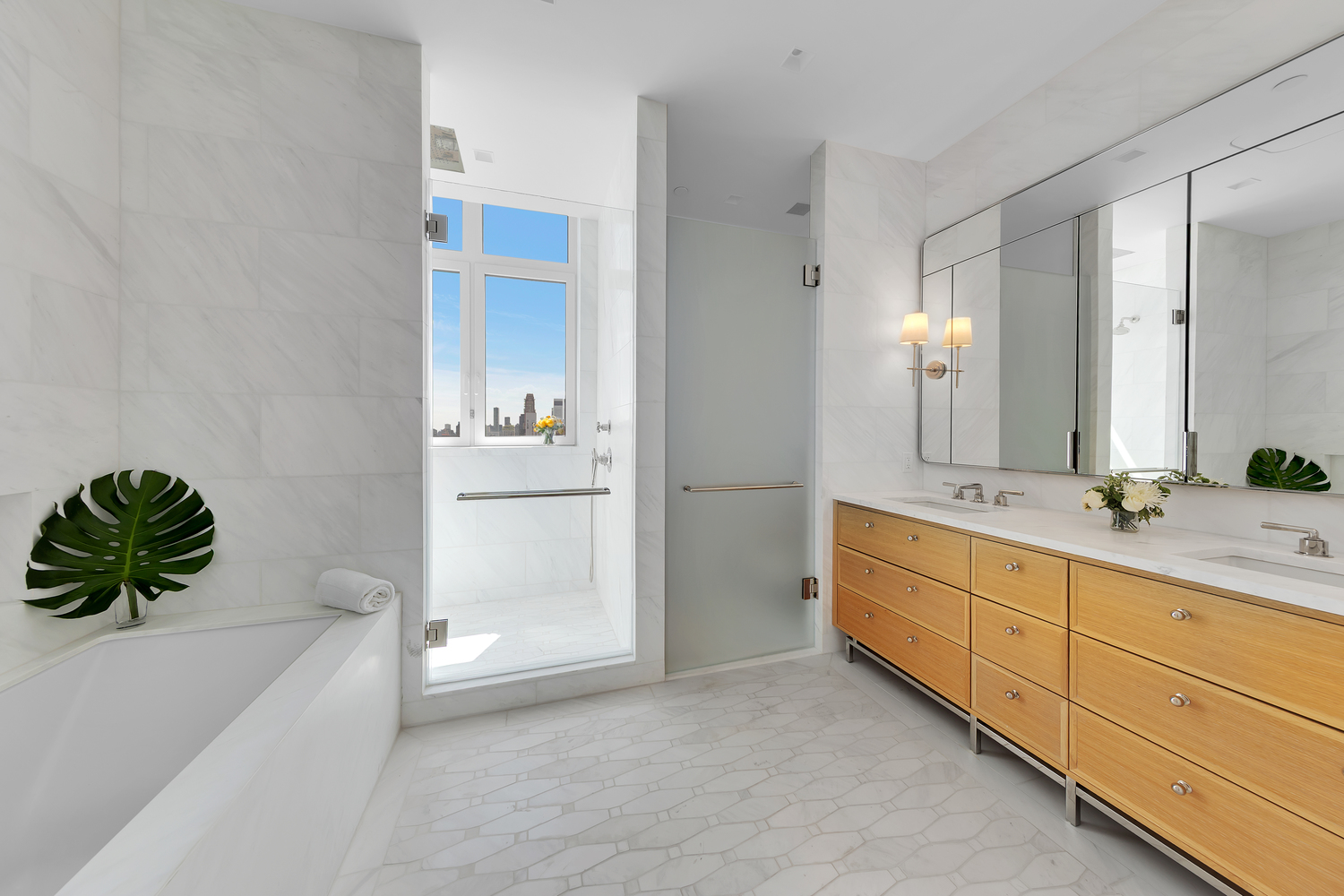 200 East 83rd Street, Unit 29B Manhattan, NY 10028 - Photo 6 of 20 a bathroom with a tub sink and mirror