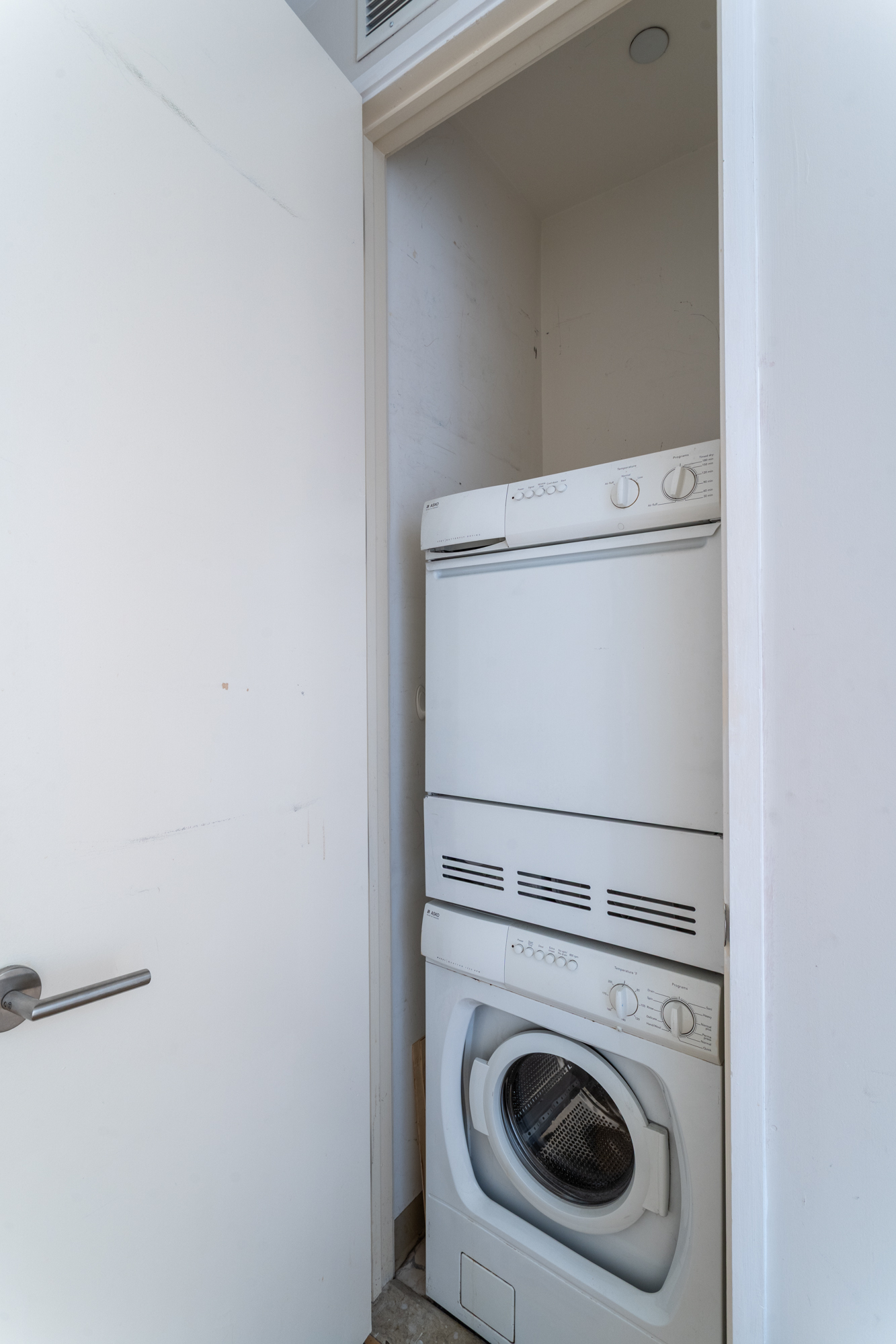 450 East 83rd Street, Unit 5K Manhattan, NY 10028 - Photo 11 of 16 a close up view of washer and dryer