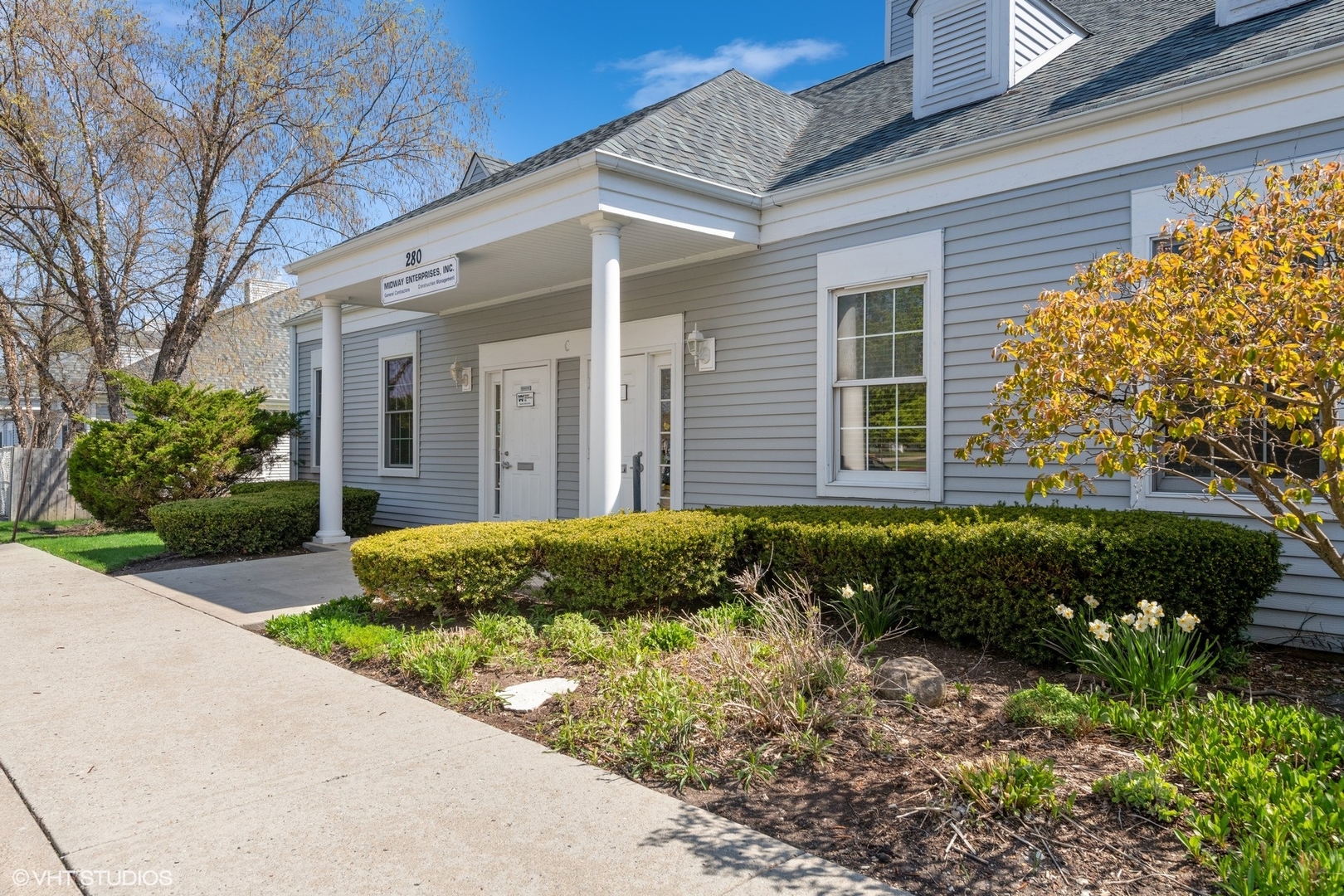 280 North Rand Road Lake Zurich, IL 60047 - Photo 4 of 28 a front view of a house with a yard