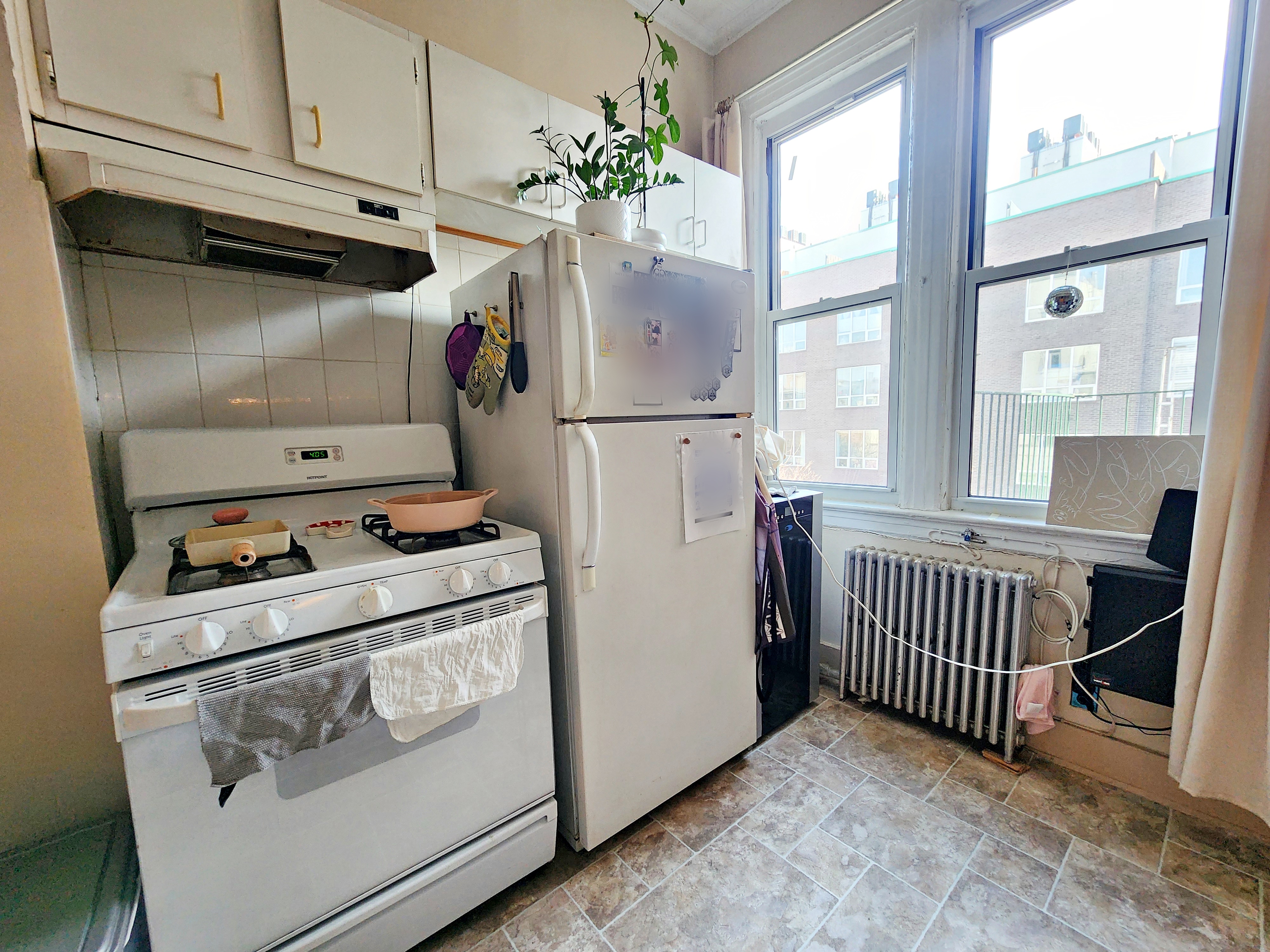 148 Withers Street, Unit 3L Brooklyn, NY 11211 - Photo 4 of 9 a kitchen with appliances and a window
