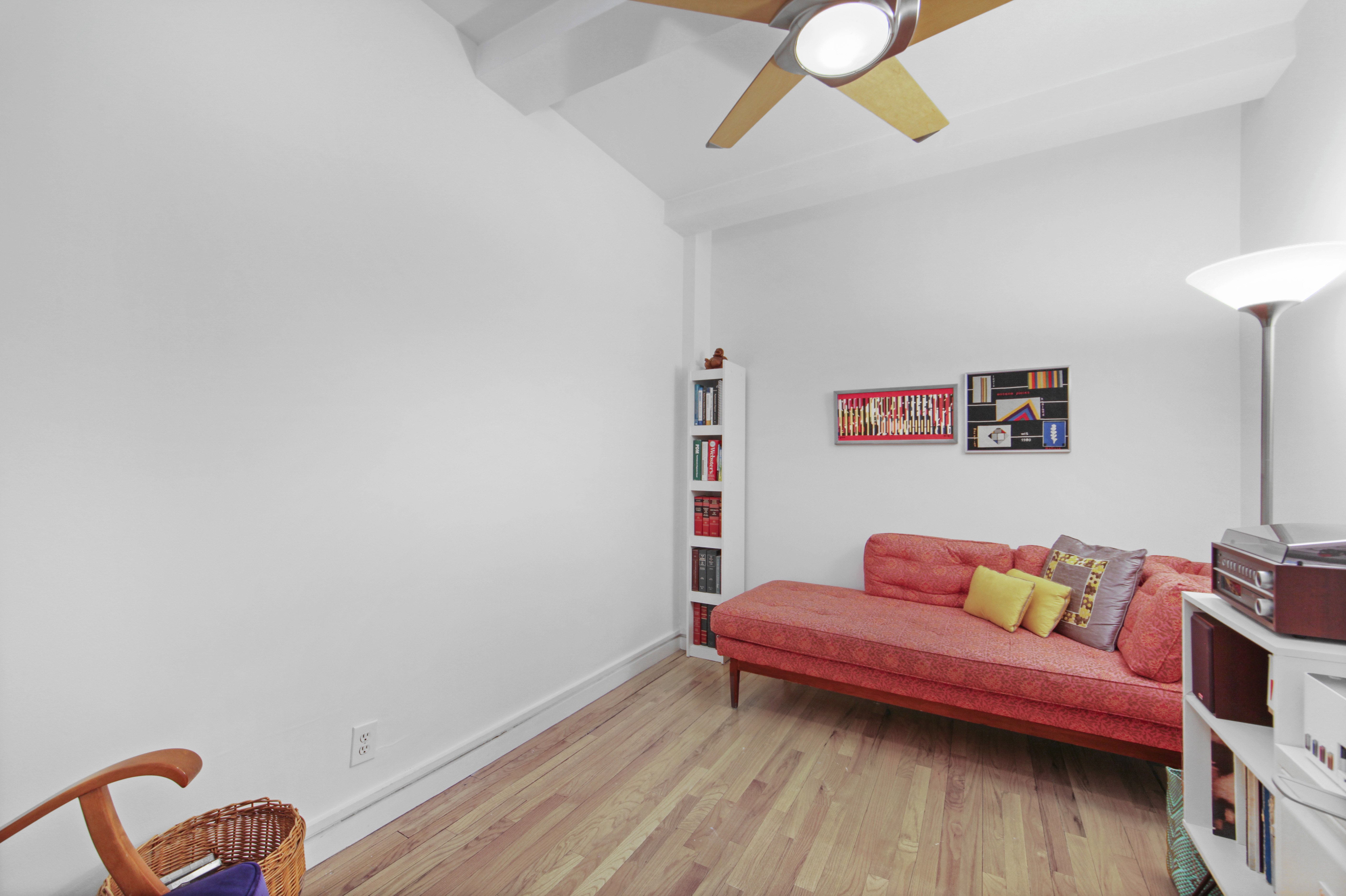 18 East 12th Street, Unit 7BC Manhattan, NY 10003 - Photo 23 of 26 a bedroom with furniture and wooden floor