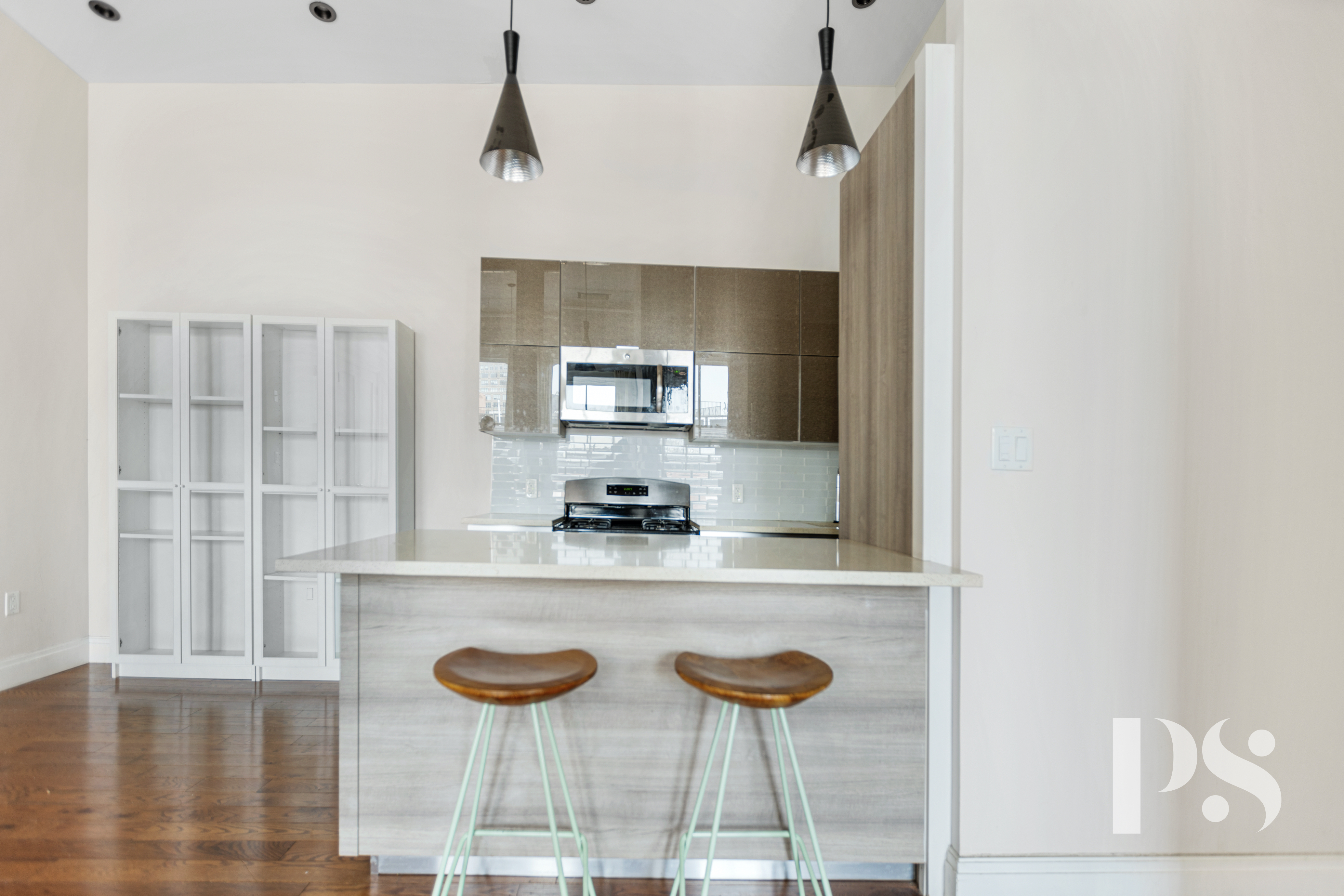 2 Wooster Street, Unit 5A Manhattan, NY 10013 - Photo 6 of 12 a kitchen with a cabinets and chairs