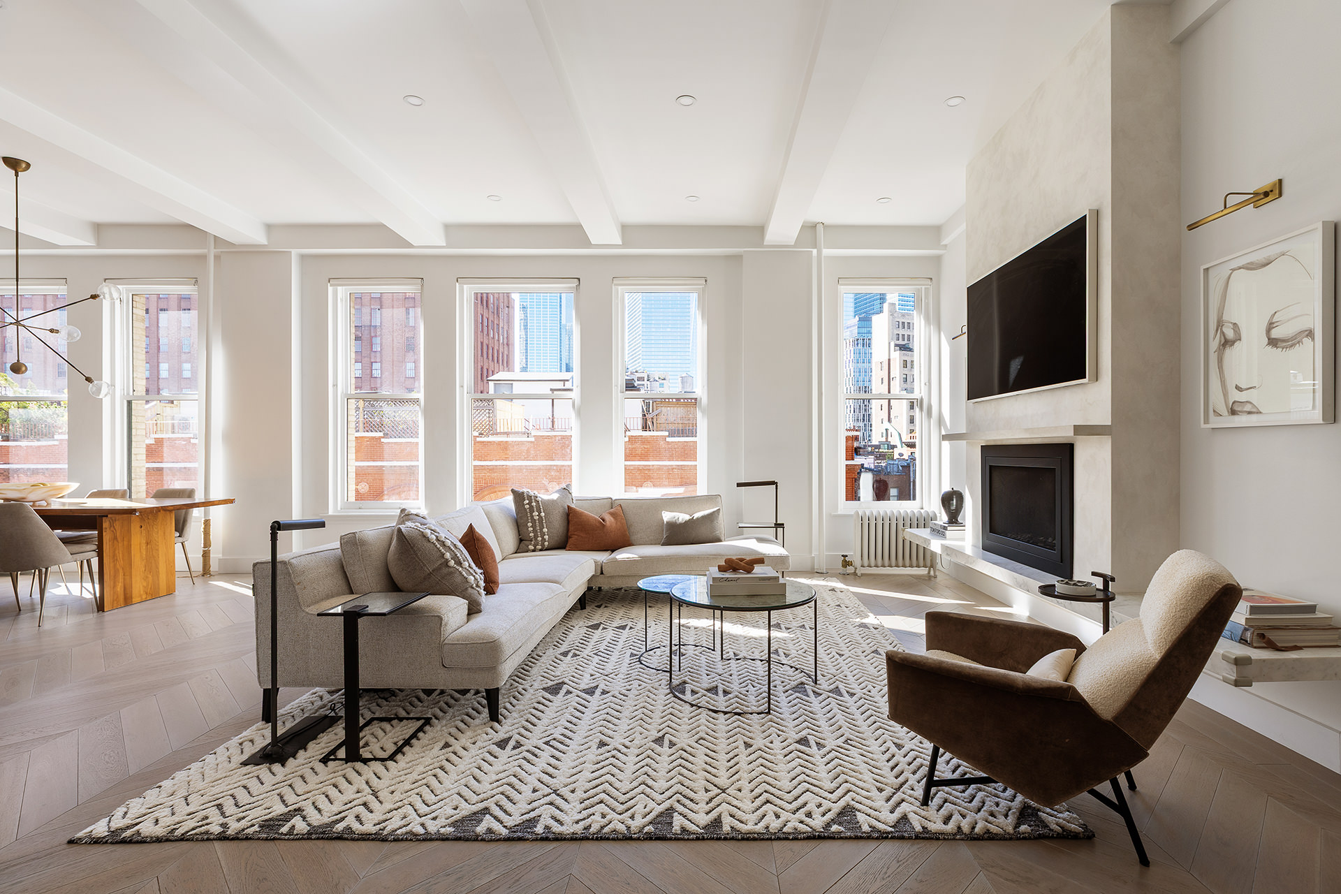 100 Hudson Street, Unit 7BC Manhattan, NY 10013 - Photo 2 of 20 a living room with fireplace furniture and a flat screen tv