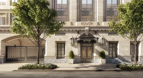 a front view of a building with garage and glass windows