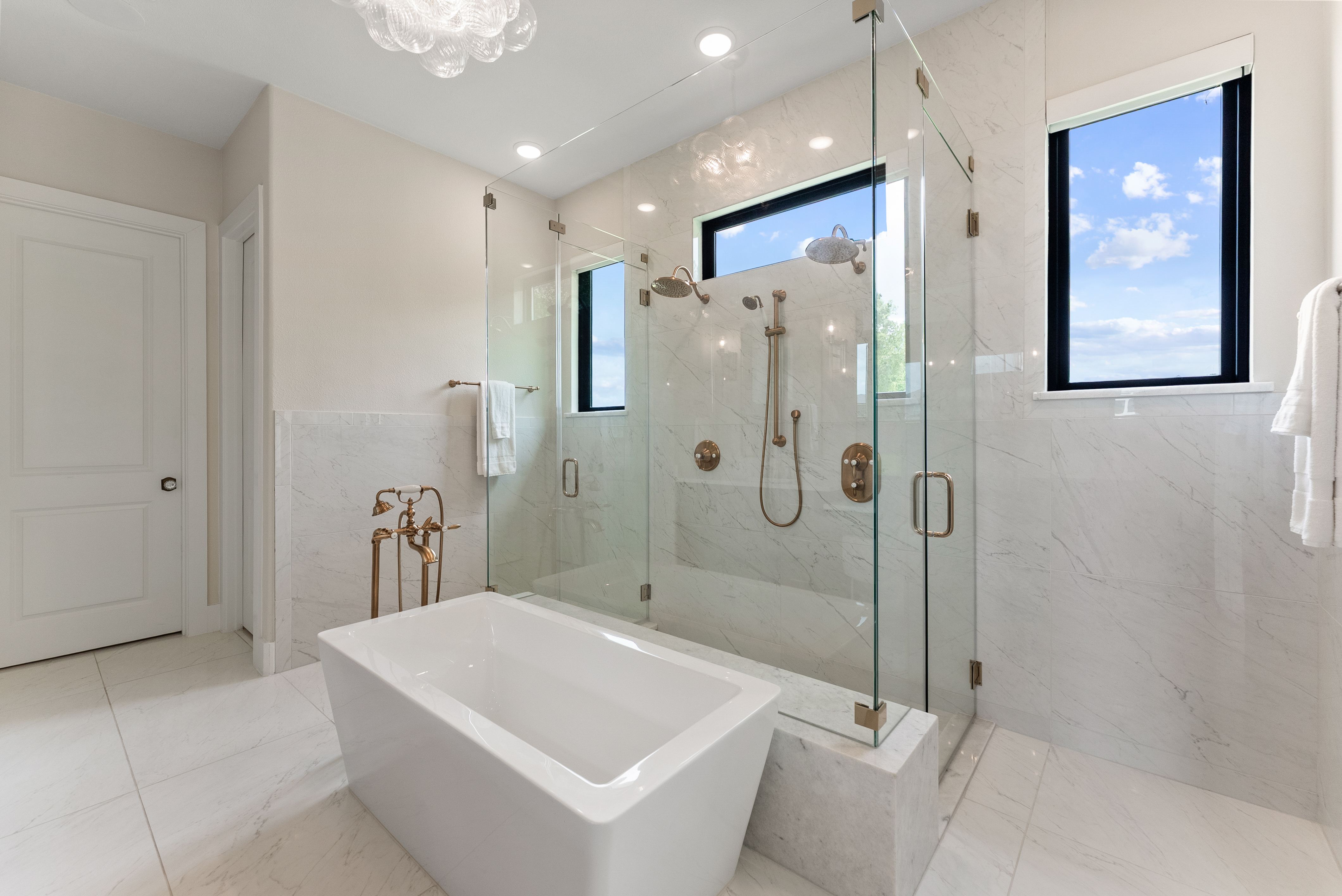 2118 Bennet Court Conroe, TX 77384 - Photo 30 of 70 a bathroom with a white bath tub a shower and a sink
