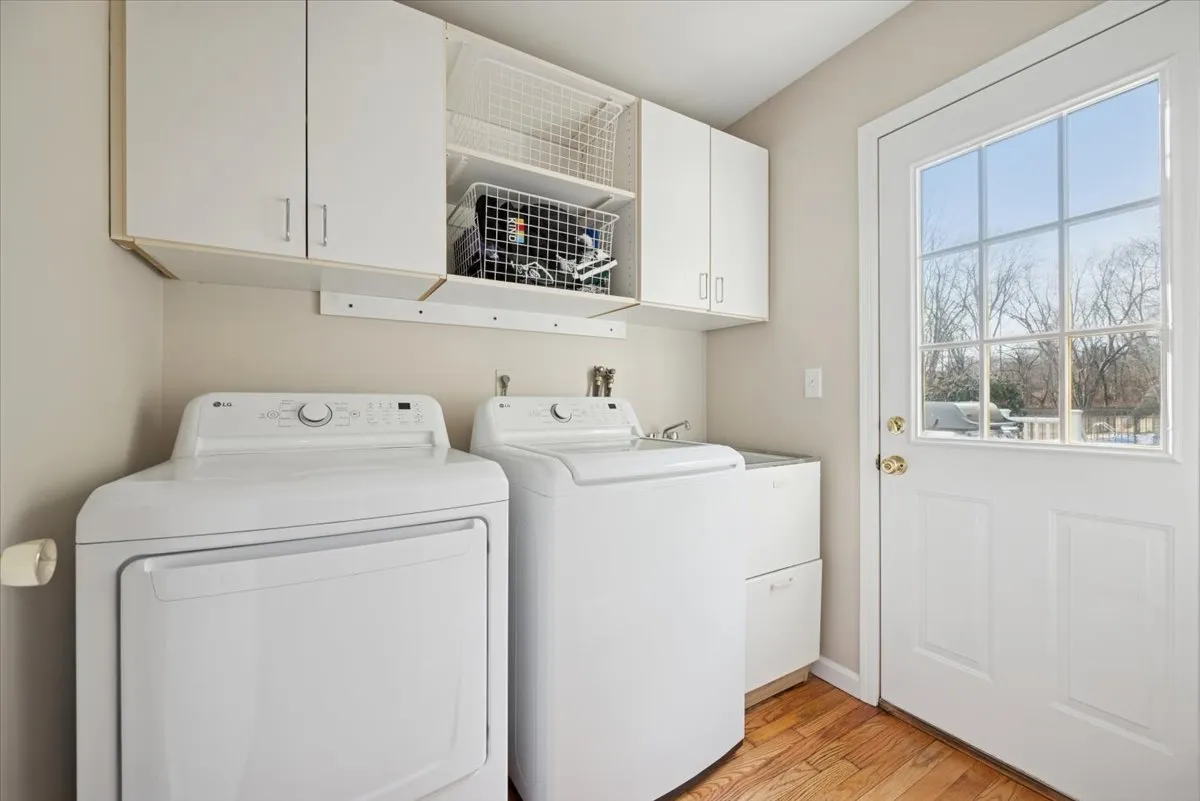 a bedroom with a large bed and a flat screen tv