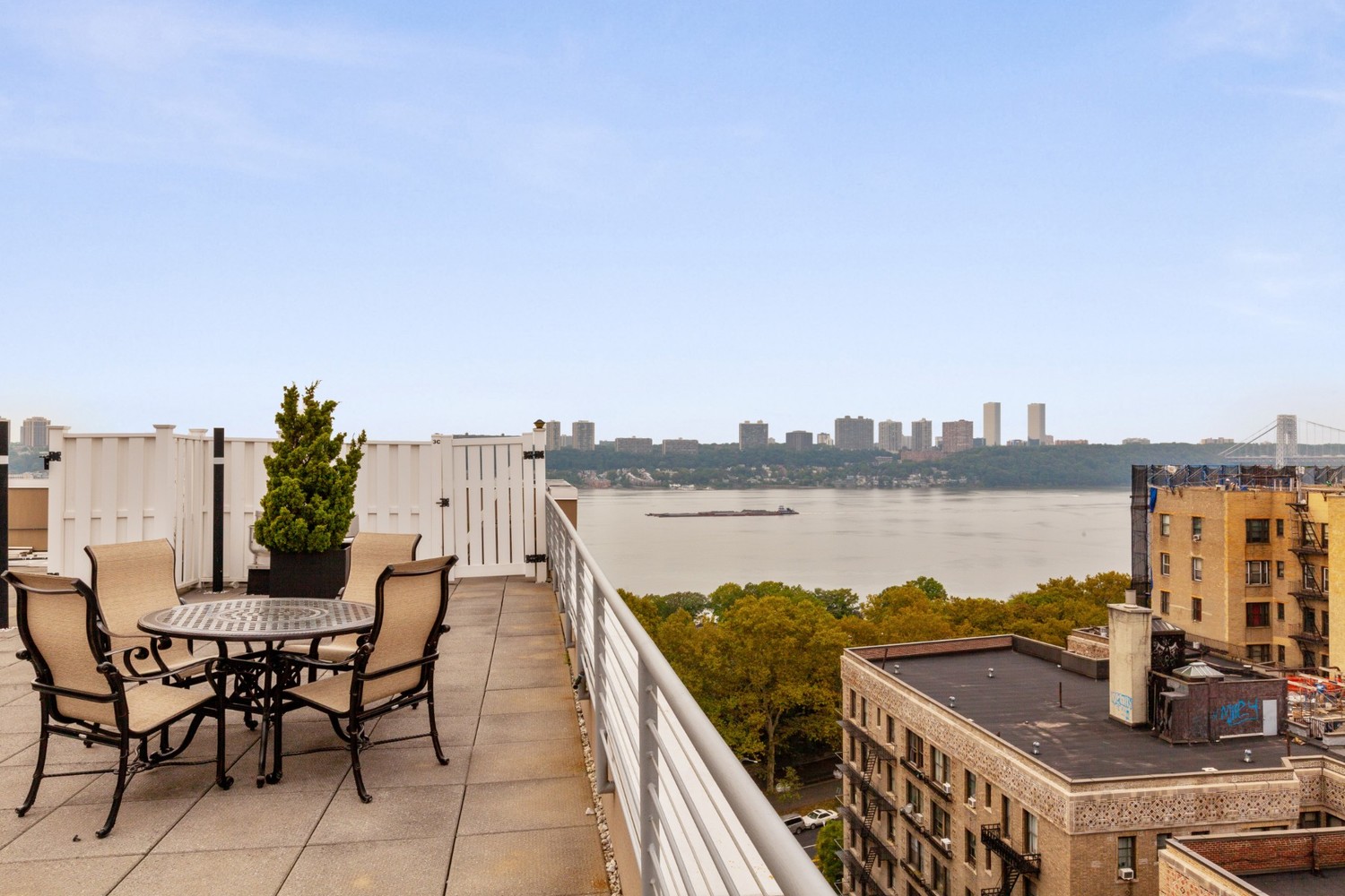 603 West 148th Street, Unit 10A Manhattan, NY 10031 - Photo 7 of 11 a terrace with outdoor seating and city view