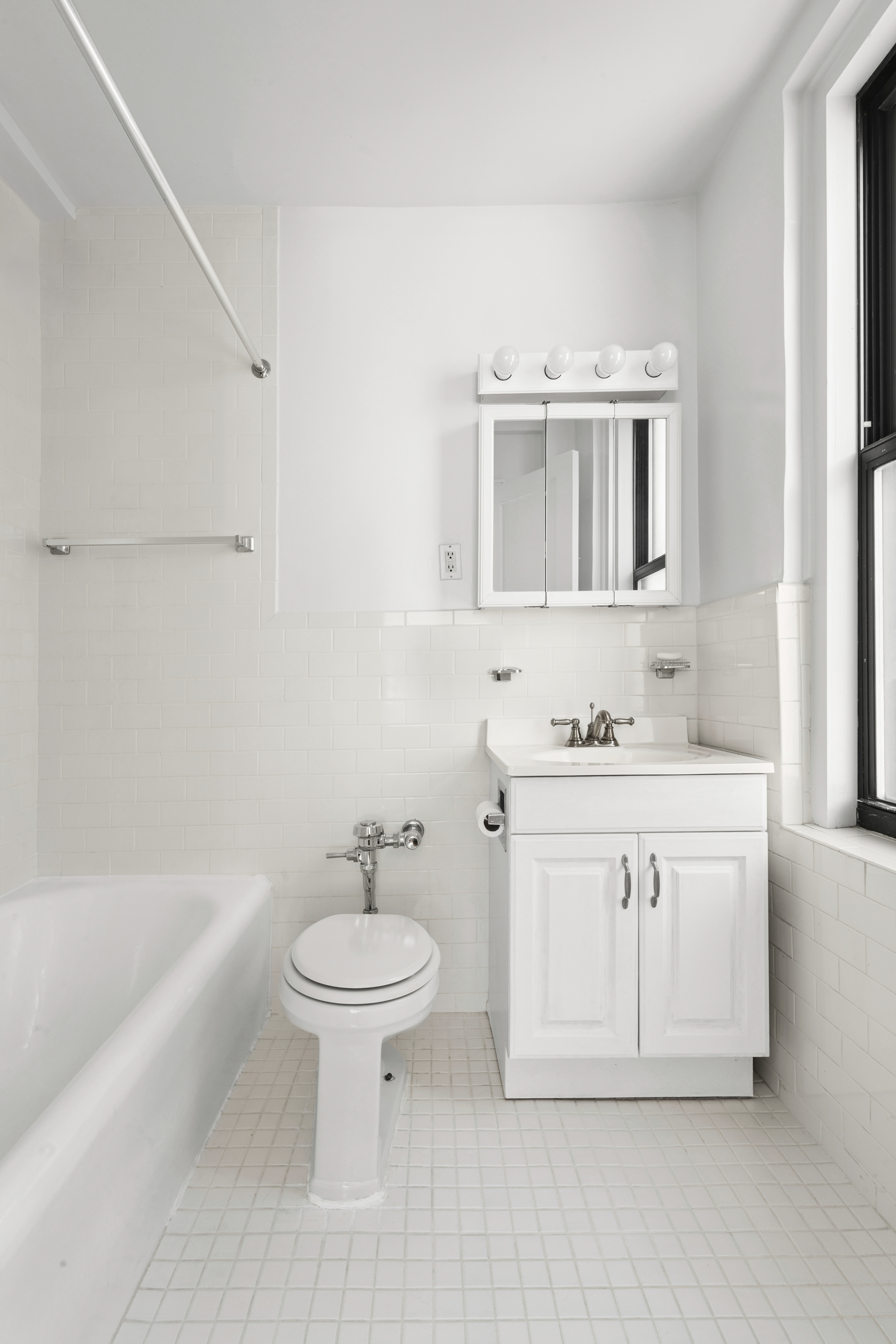 243 West End Avenue, Unit 1104 Manhattan, NY 10023 - Photo 6 of 10 a bathroom with a sink toilet and shower