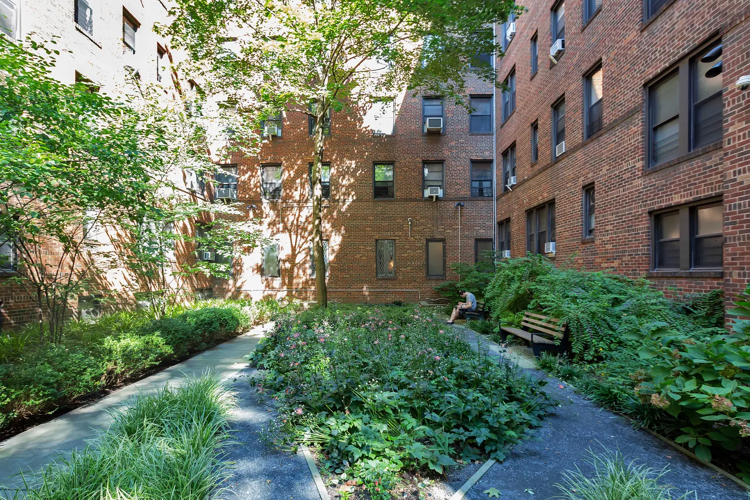 a view of a building with a yard