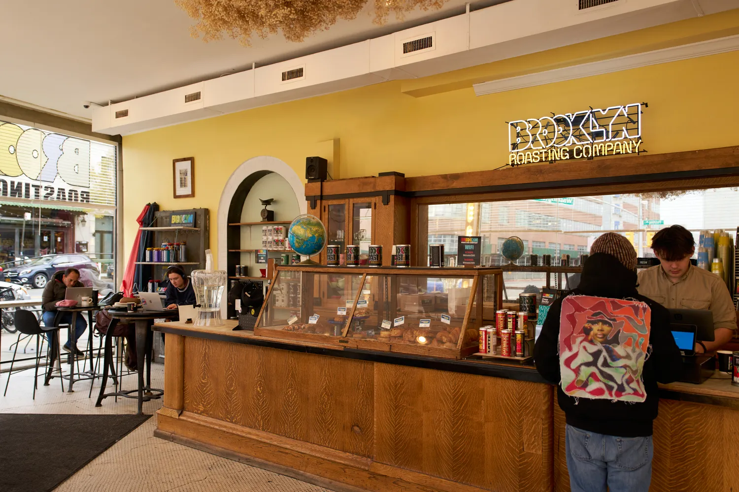 a front view of a retail shop with outdoor seating