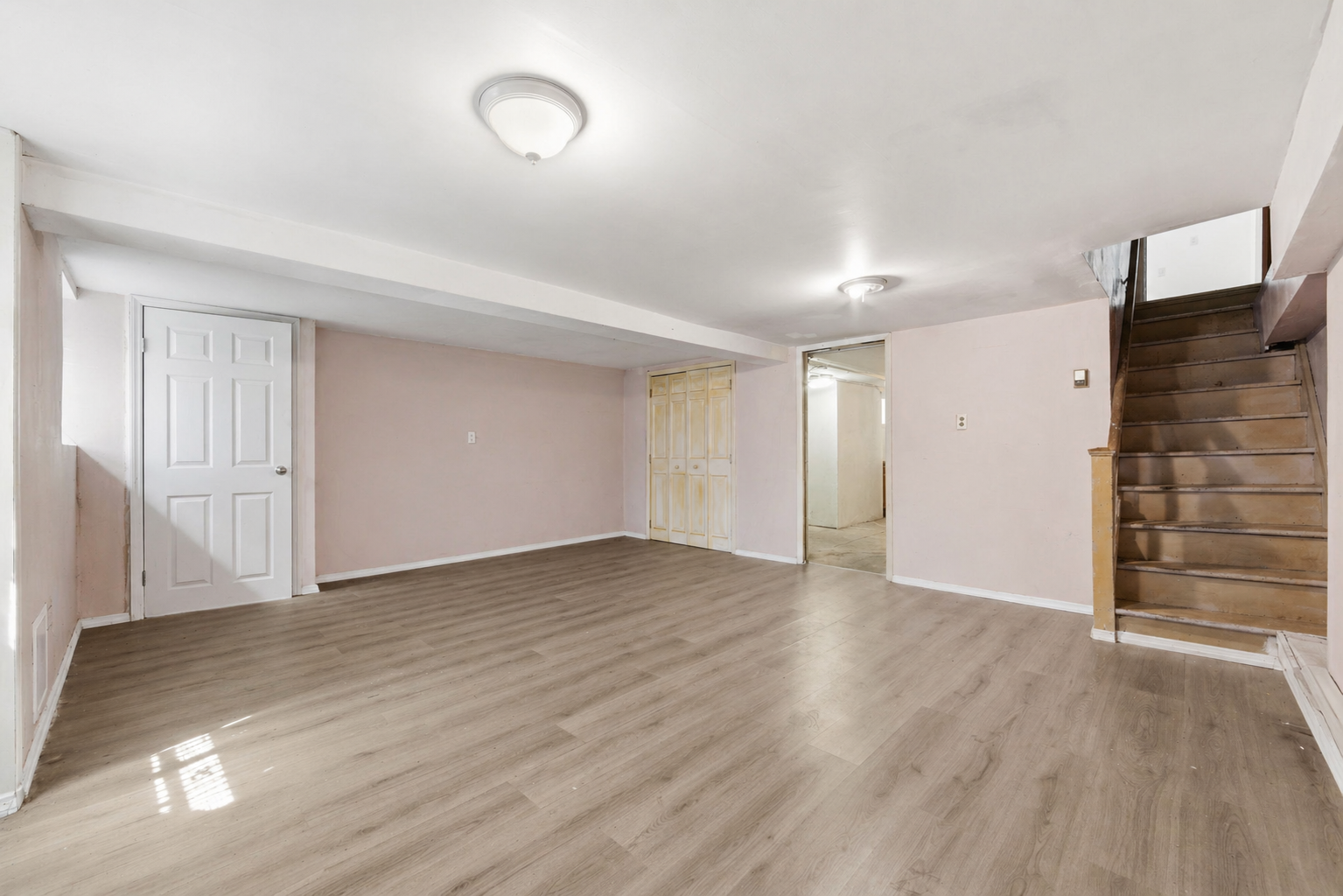 37 Chester Avenue Brooklyn, NY 11218 - Photo 12 of 14 a view of an empty room with wooden floor and closet