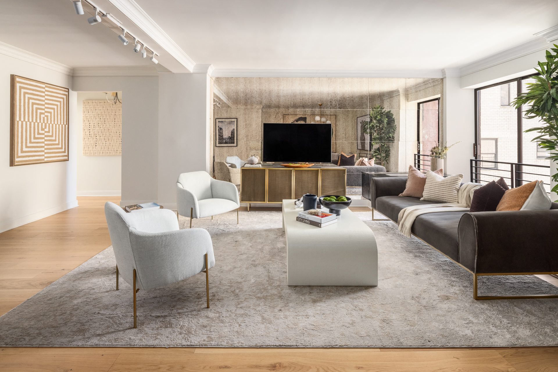 32 East 76th Street, Unit 805 Manhattan, NY 10021 - Photo 11 of 15 a living room with furniture and a flat screen tv