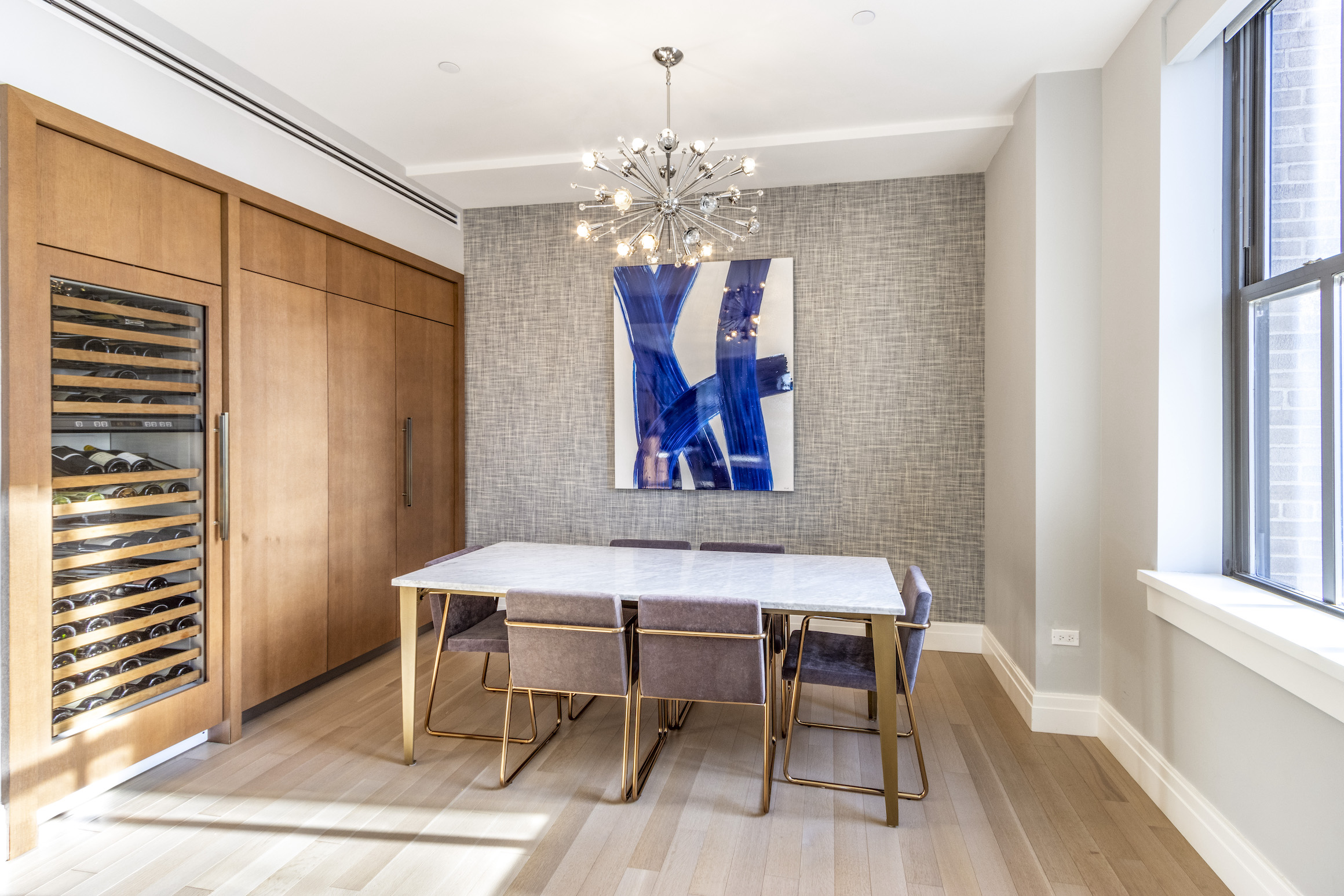 100 Barclay Street, Unit 15P Manhattan, NY 10007 - Photo 11 of 34 a view of a dining room with furniture and chandelier