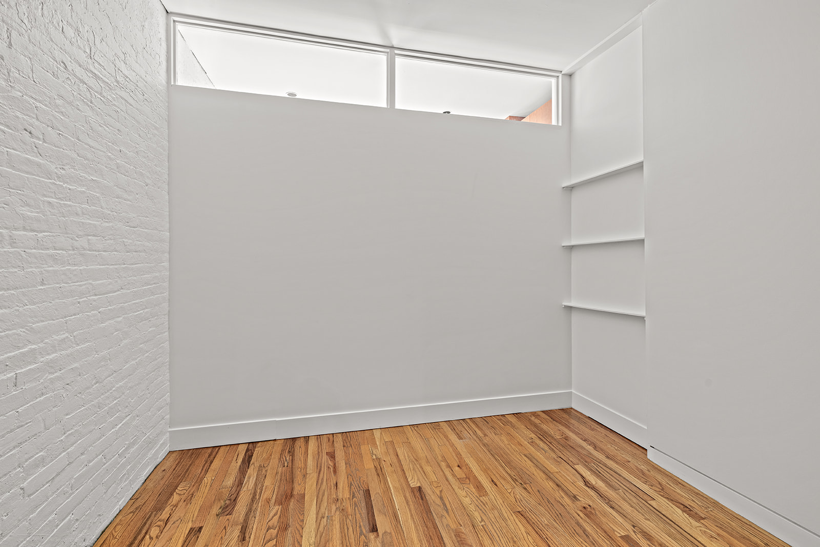 130 Watts Street, Unit 5N Manhattan, NY 10013 - Photo 7 of 11 a view of a room with wooden floor