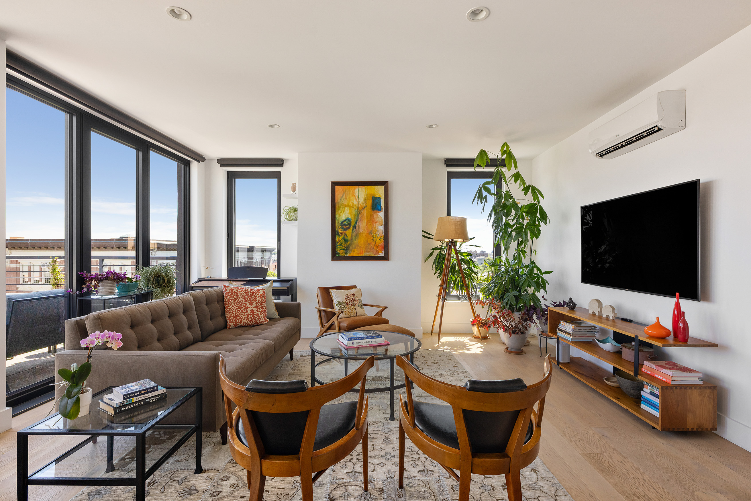 762 Park Place, Unit PH1 Brooklyn, NY 11216 - Photo 2 of 15 a living room with furniture and a flat screen tv