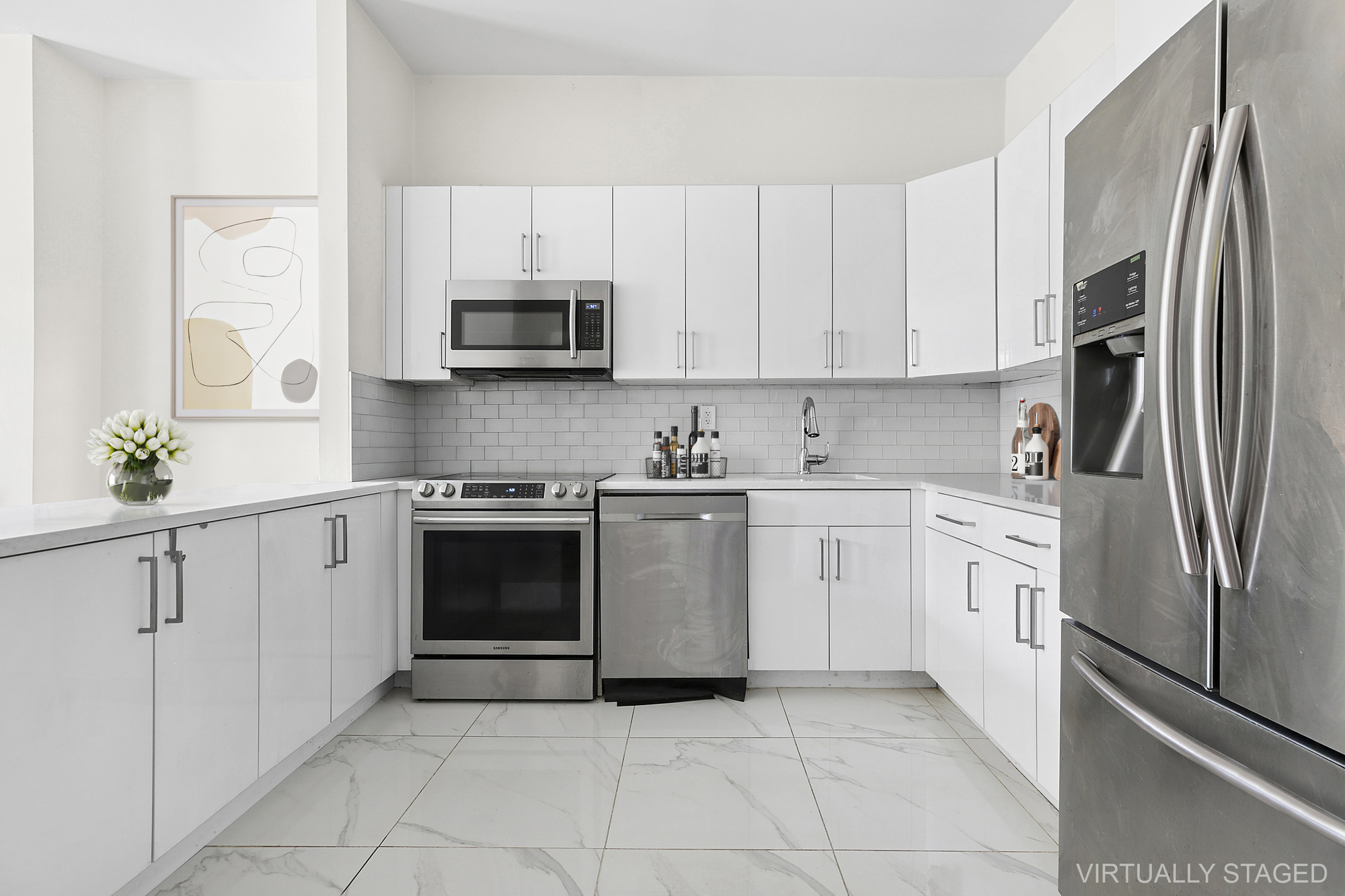 1273 Bushwick Avenue, Unit 2 Brooklyn, NY 11207 - Photo 3 of 9 a kitchen with cabinets stainless steel appliances and a counter space