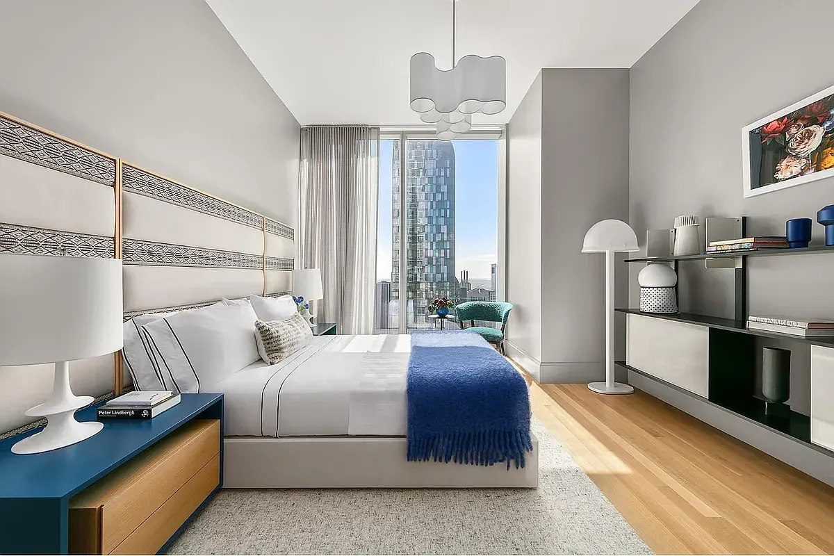 a bedroom with bed and window