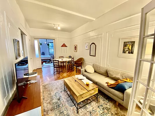 351 7th Avenue, Unit 2 Brooklyn, NY 11215 - Photo 4 of 10 a living room with furniture a rug and a flat screen tv