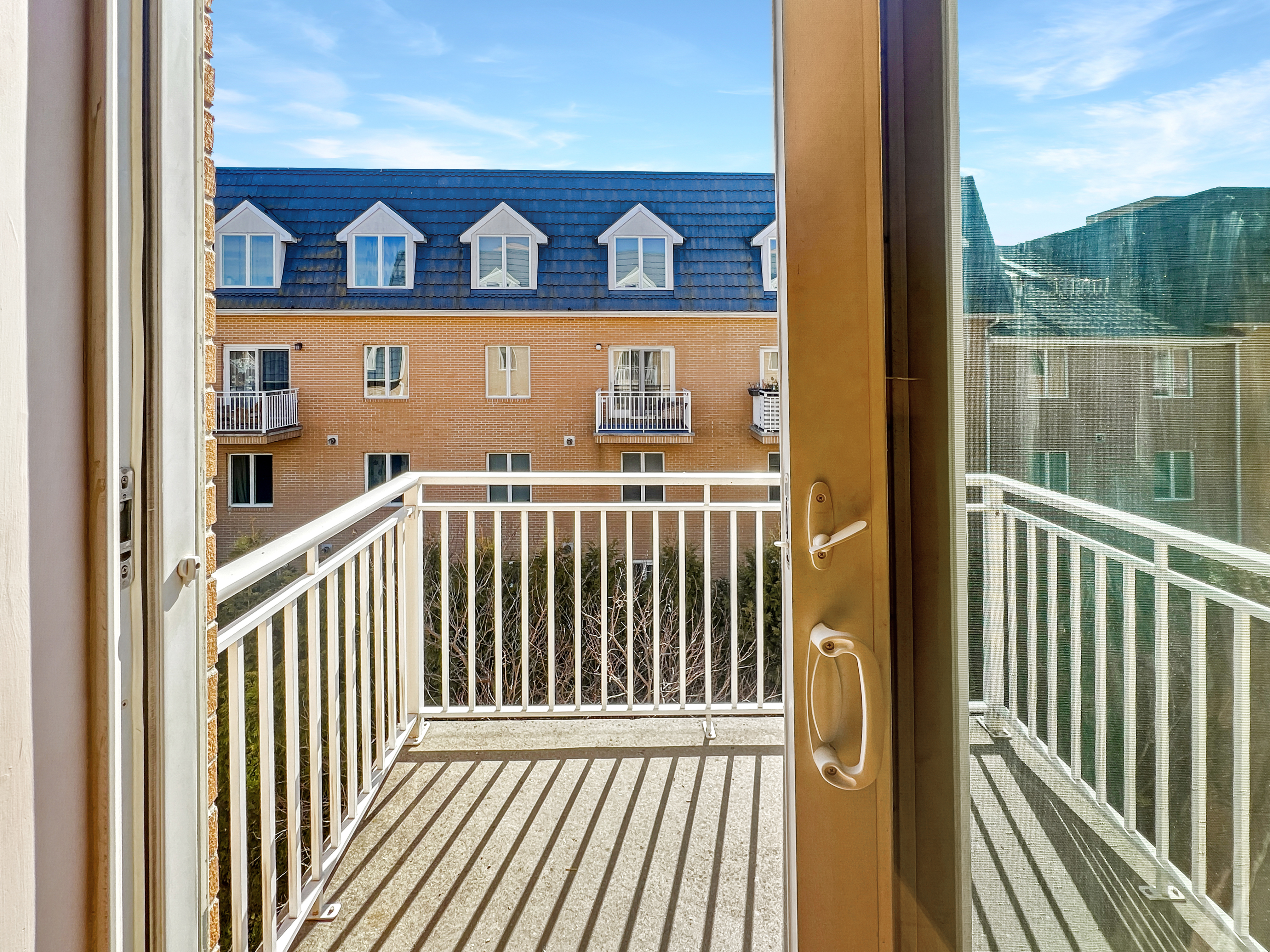 1467 Royce Street, Unit 3L Brooklyn, NY 11234 - Photo 2 of 14 a view of a balcony with a door and wooden floor