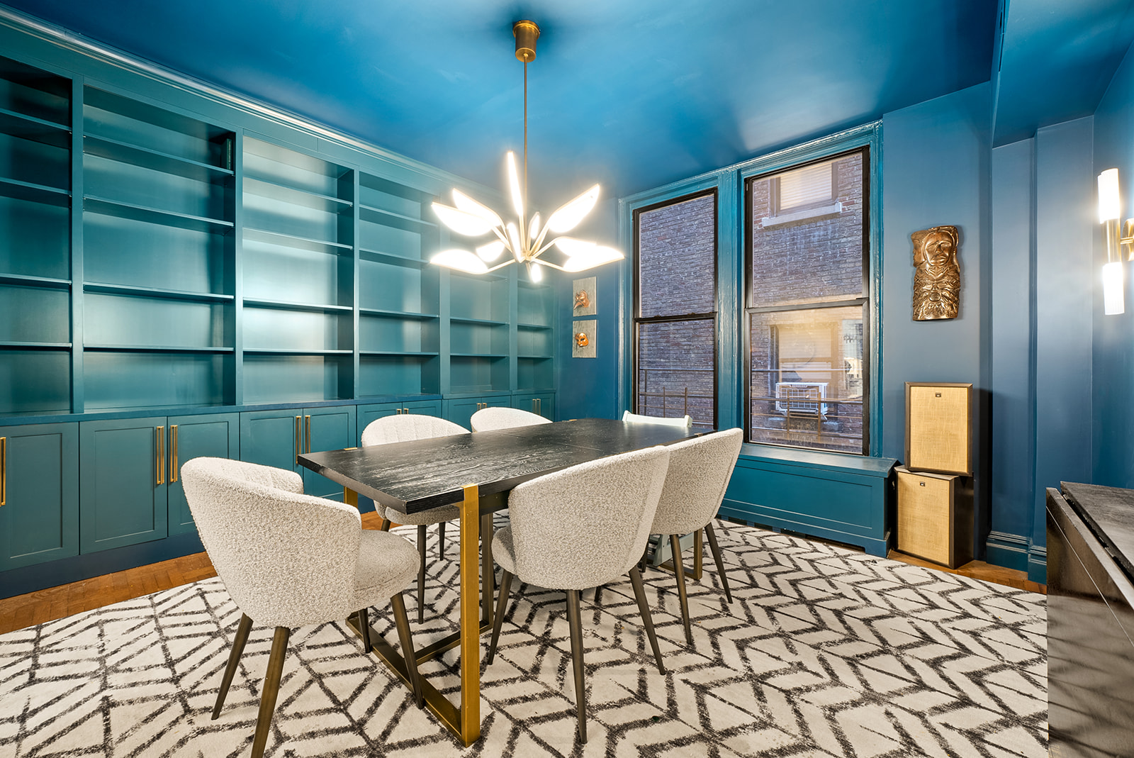 152 West 58th Street, Unit 6CD Manhattan, NY 10019 - Photo 2 of 9 a view of a dining room with furniture a chandelier and wooden floor