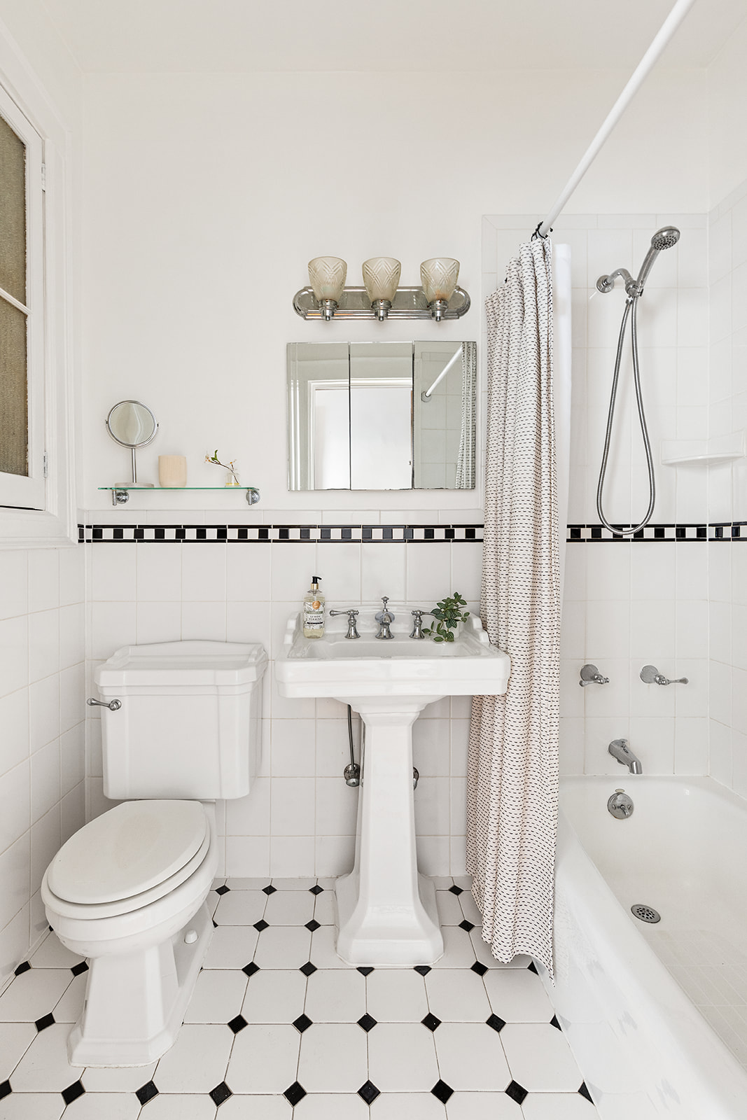 521 84th Street Brooklyn, NY 11209 - Photo 5 of 19 a bathroom with a sink a toilet and shower