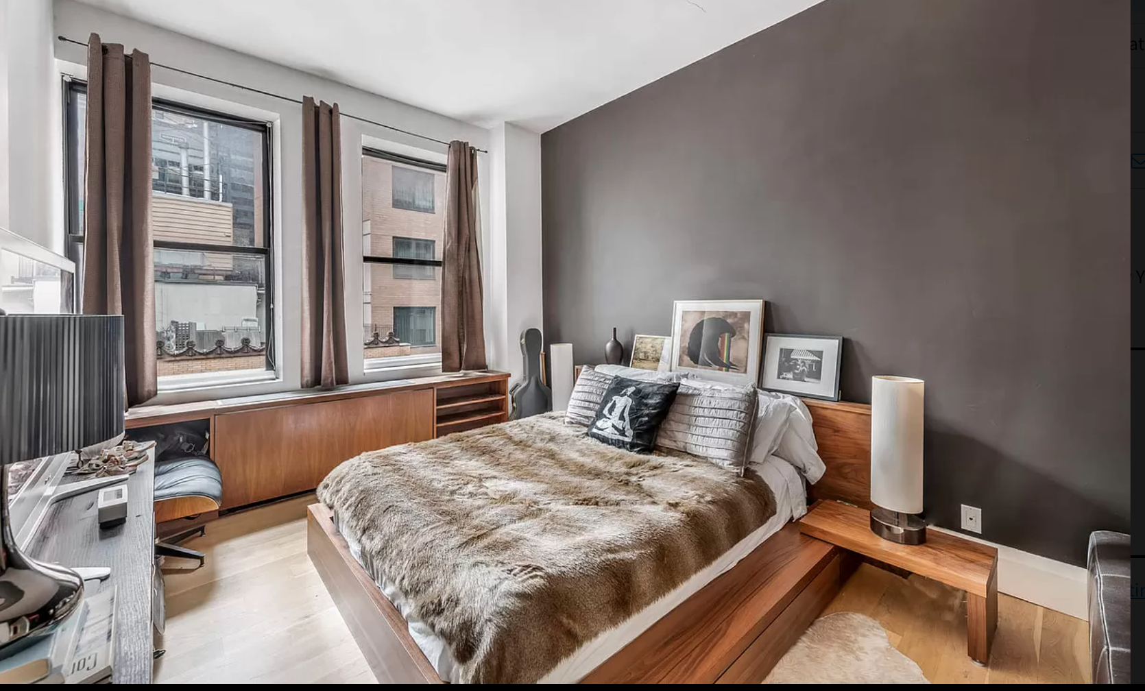 71 Nassau Street, Unit 12C Manhattan, NY 10038 - Photo 8 of 18 a bedroom with a bed and window