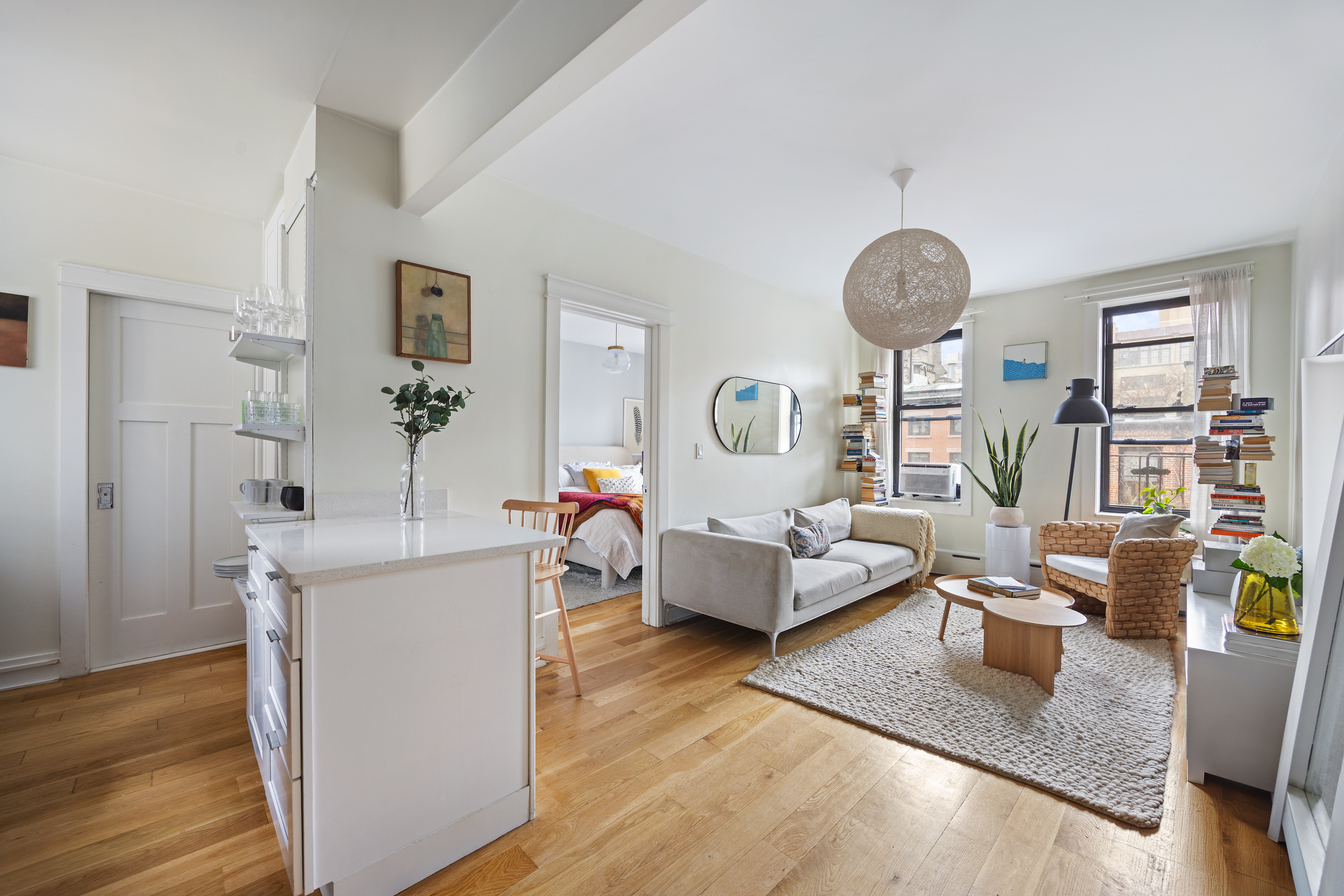 342 West 21st Street, Unit 4B Manhattan, NY 10011 - Photo 1 of 9 a living room with furniture and wooden floor