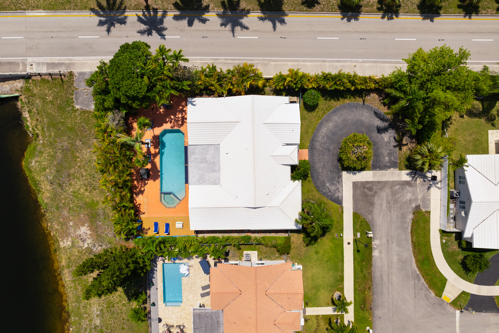 8610 Southwest 83rd Street Miami, FL 33143 - Photo 7 of 46 an aerial view of a house with a garden and swimming pool