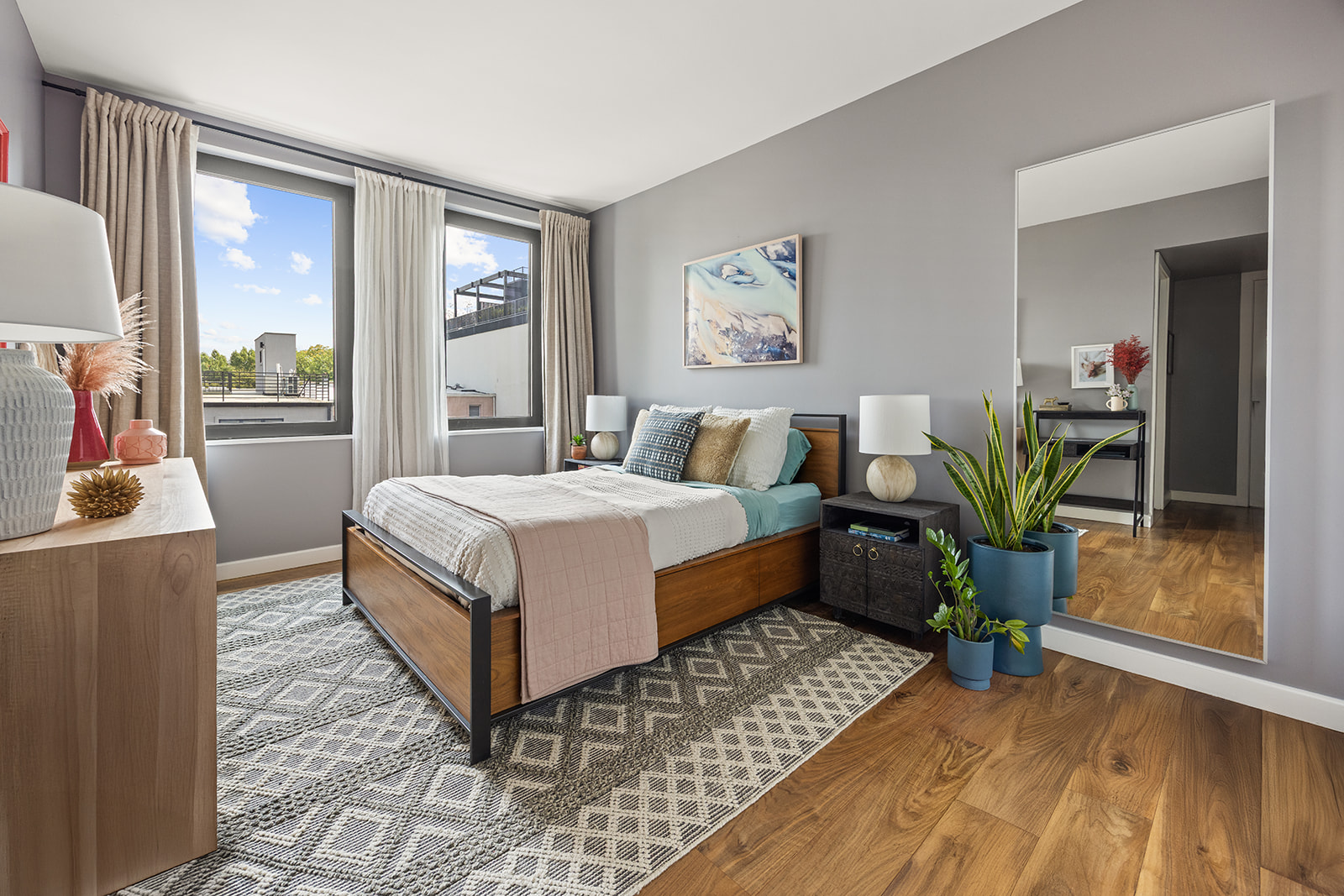 305 23rd Street, Unit 3W Brooklyn, NY 11215 - Photo 7 of 21 a bedroom with a bed table mirror and window