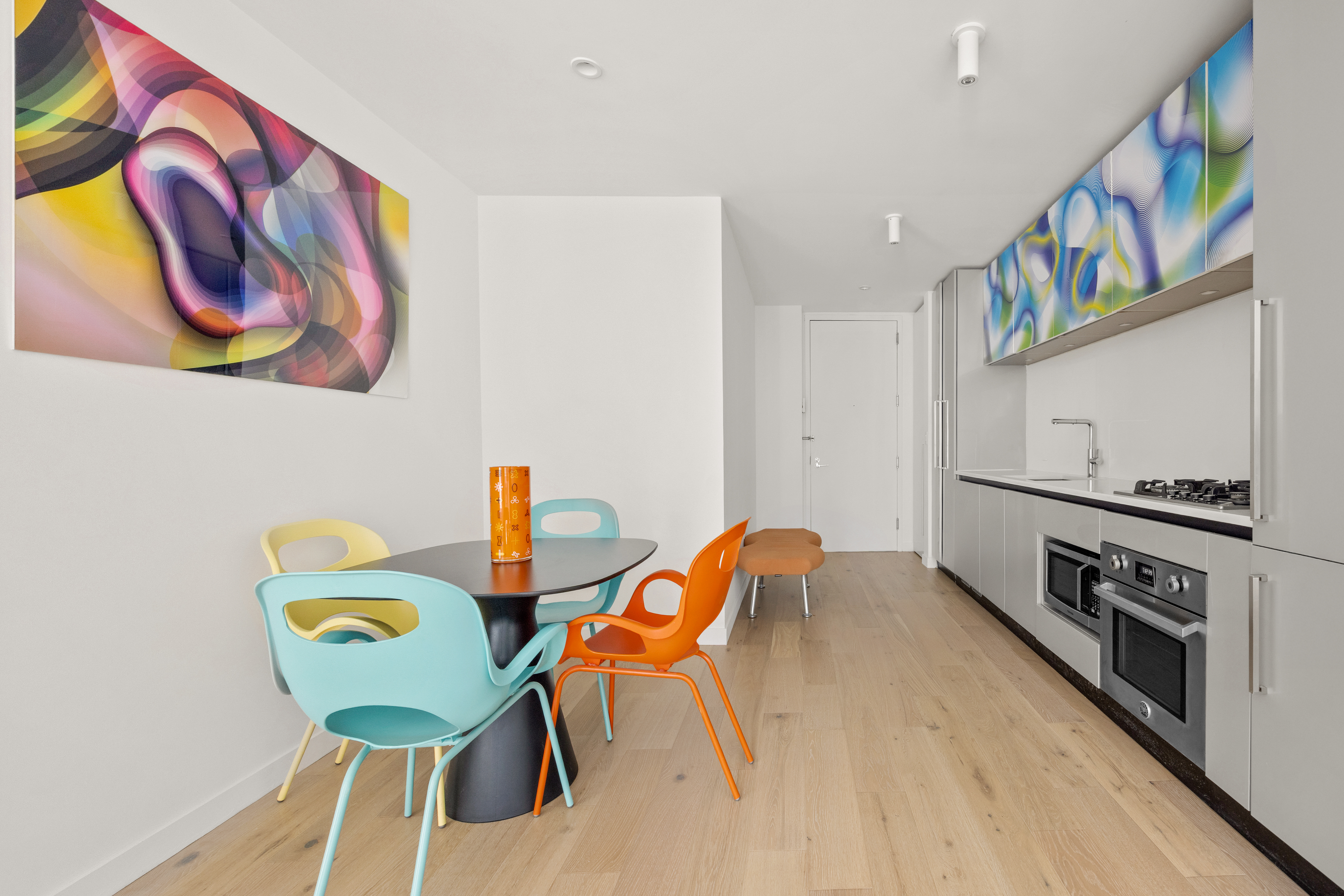 540 West 49th Street, Unit 506S Manhattan, NY 10019 - Photo 3 of 8 a dining room with furniture and wooden floor