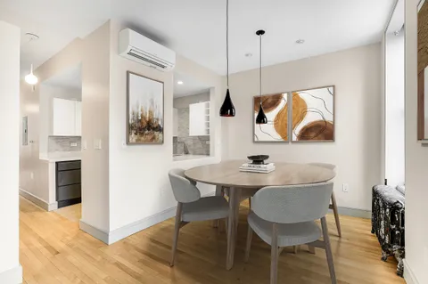 a view of kitchen with cabinets and wooden floor