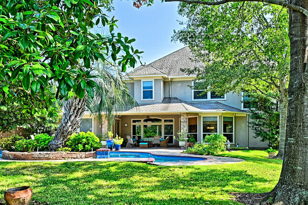 17311 Autumn Oak Court, Spring, TX, USA Spring, TX 77379 - Photo 3 of 9 a front view of a house with a yard table and chairs