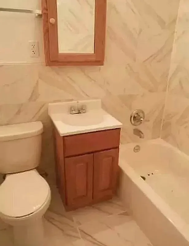 a bathroom with a sink a toilet and bathtub