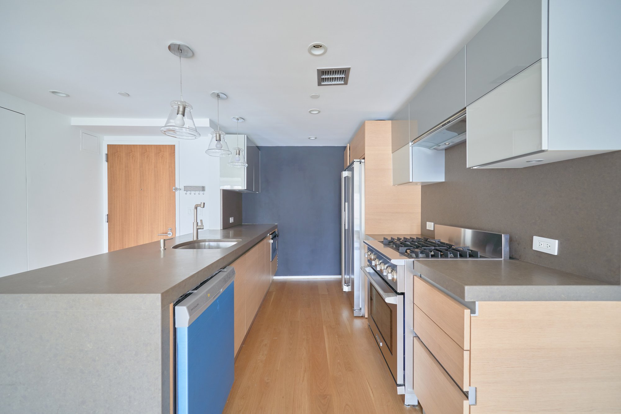 2280 Frederick Douglass Boulevard, Unit 5D Manhattan, NY 10027 - Photo 3 of 22 a kitchen with stainless steel appliances granite countertop a sink and a stove