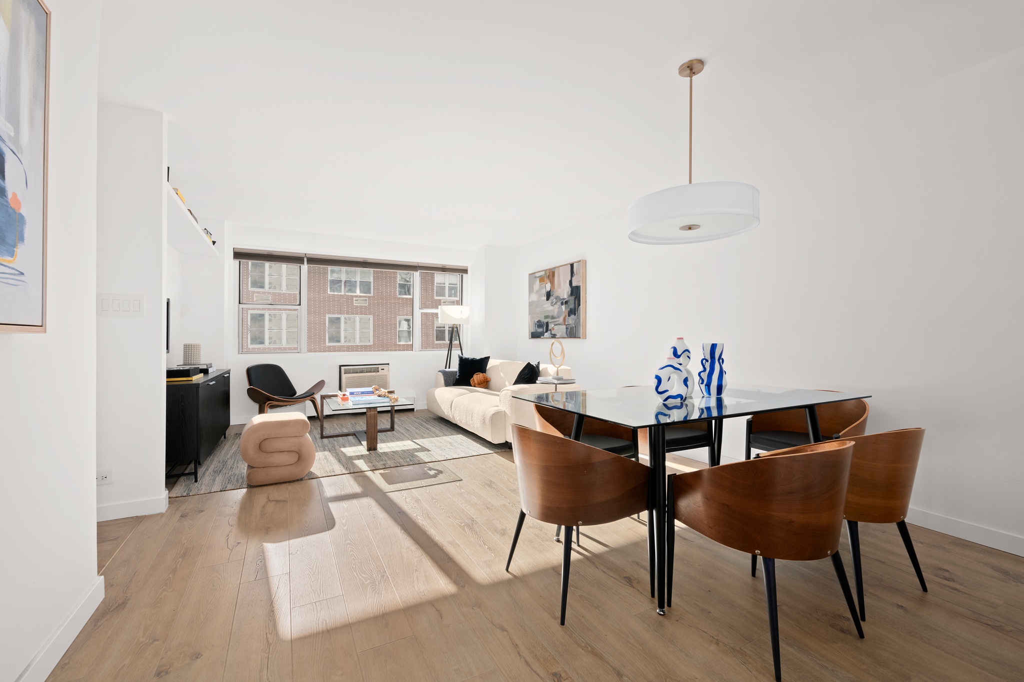 79 West 12th Street, Unit 6BC Manhattan, NY 10011 - Photo 1 of 15 a living room with furniture and wooden floor