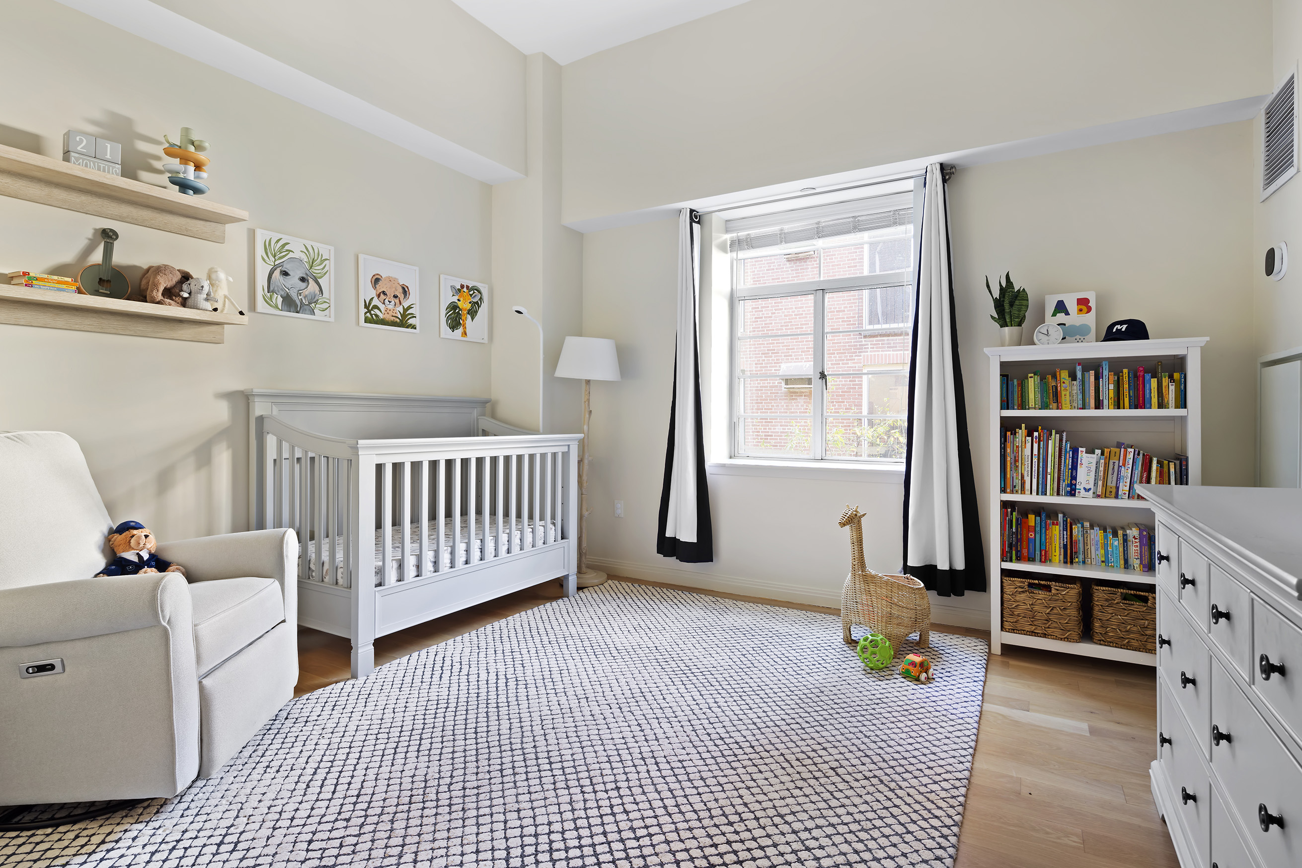 9 College Place, Unit 2K Brooklyn, NY 11201 - Photo 11 of 17 a bedroom with furniture and book shelf
