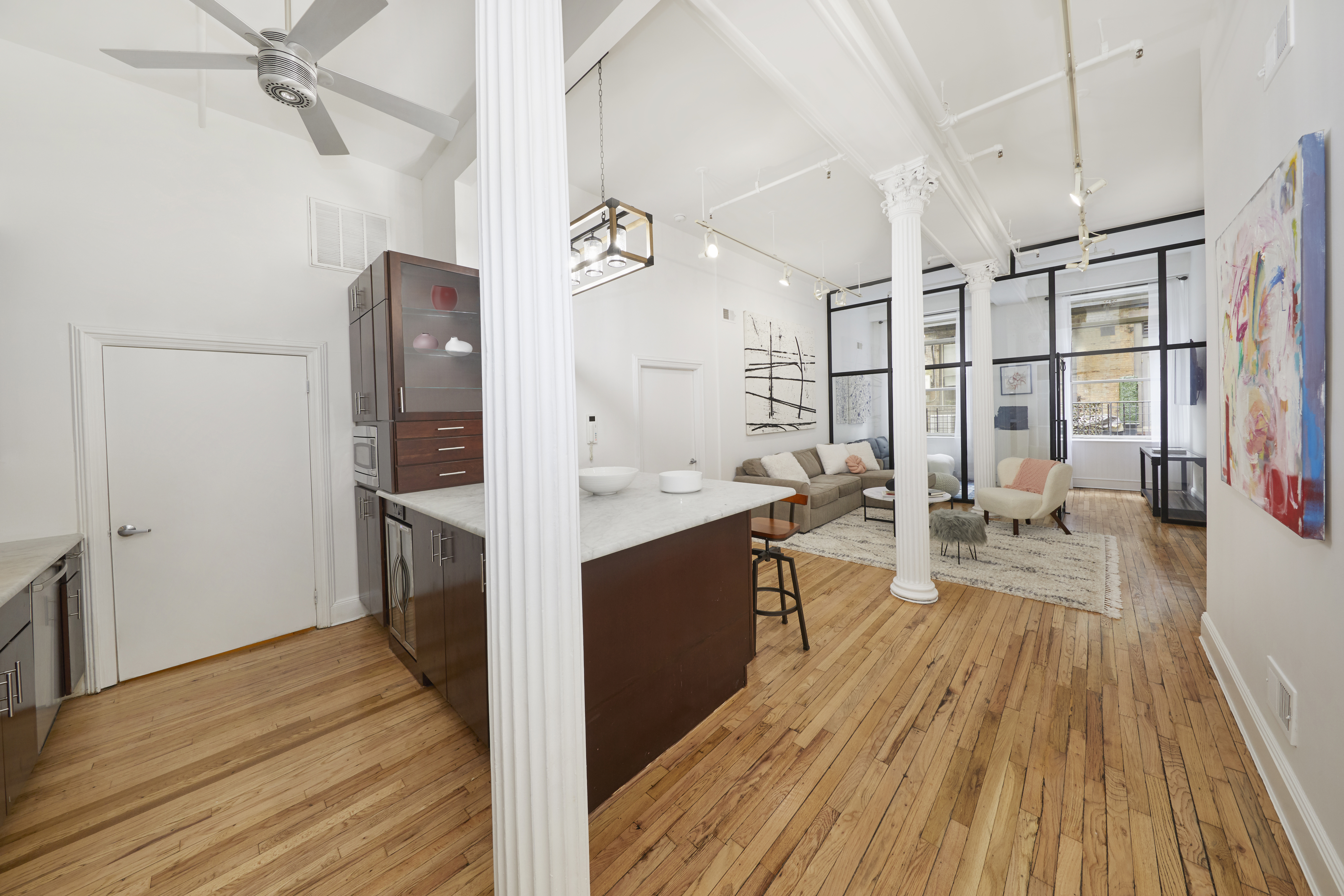 80 Leonard Street, Unit 3G Manhattan, NY 10013 - Photo 5 of 30 a view of a kitchen interior of the house and wooden floor