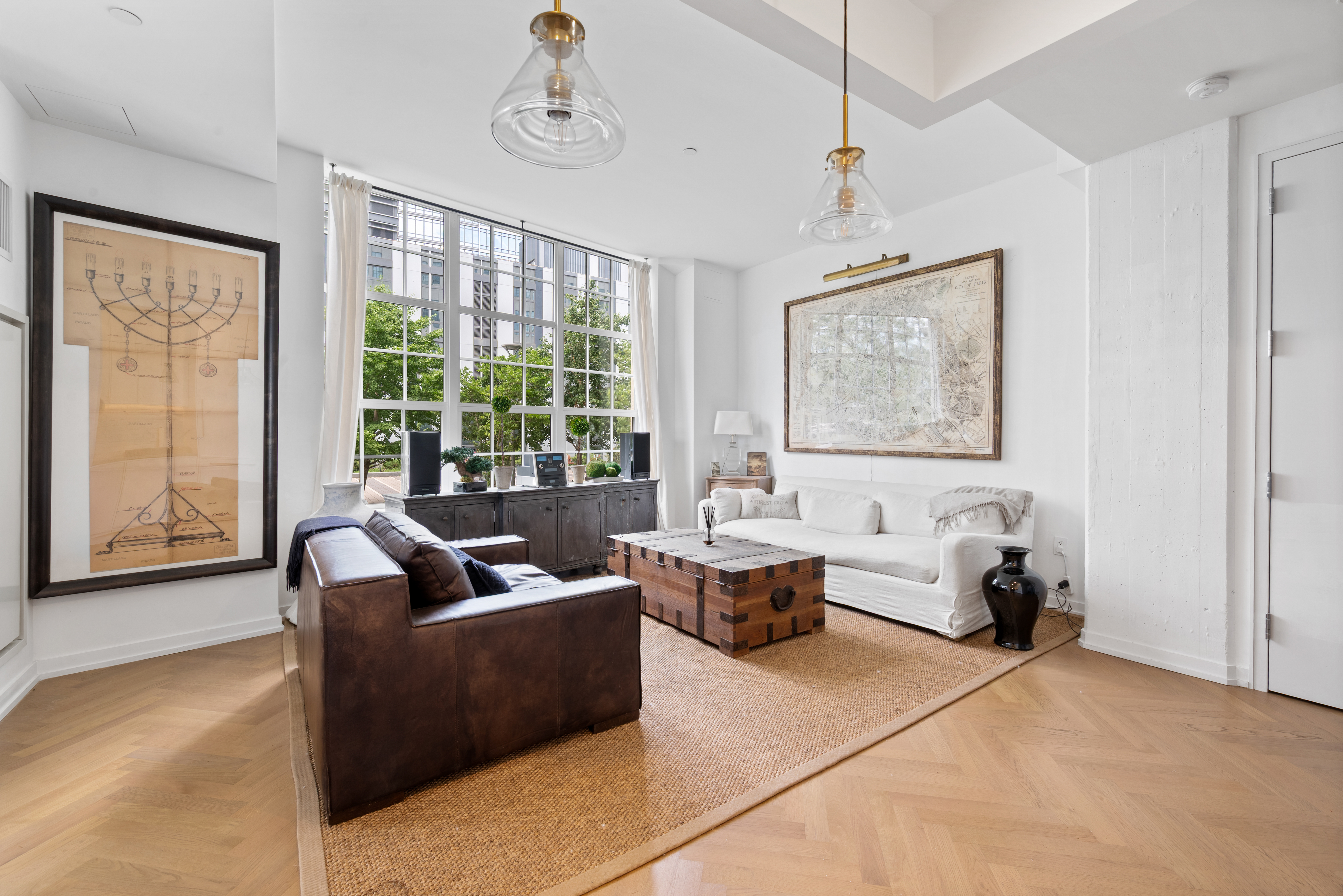 184 Kent Avenue, Unit C107 Brooklyn, NY 11249 - Photo 2 of 18 a living room with furniture and large windows