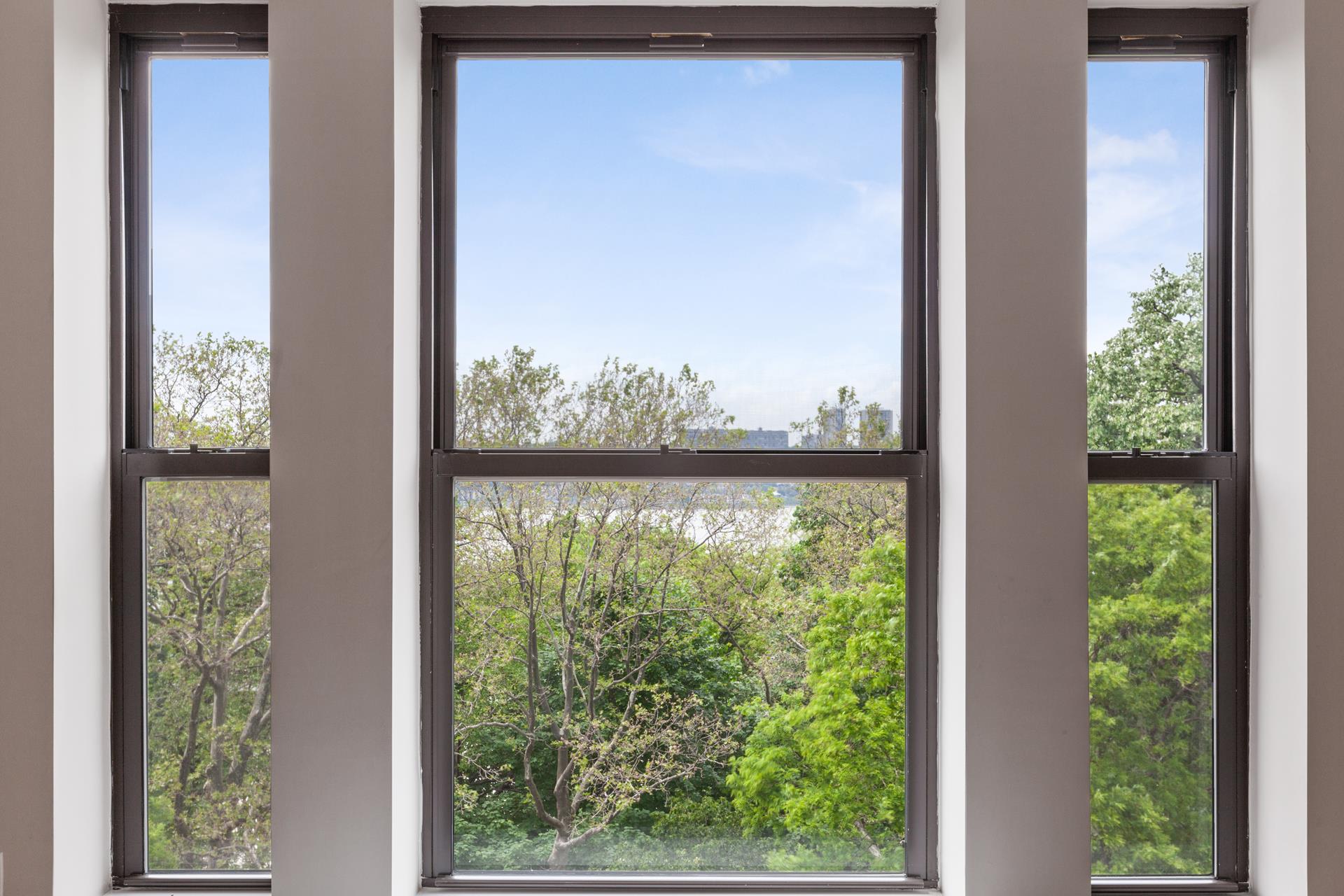 690 Riverside Drive, Unit 5D Manhattan, NY 10031 - Photo 2 of 9 a view of a room that has a large window