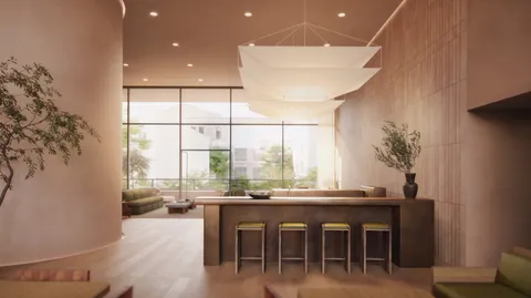 a dining room with furniture large windows and a chandelier