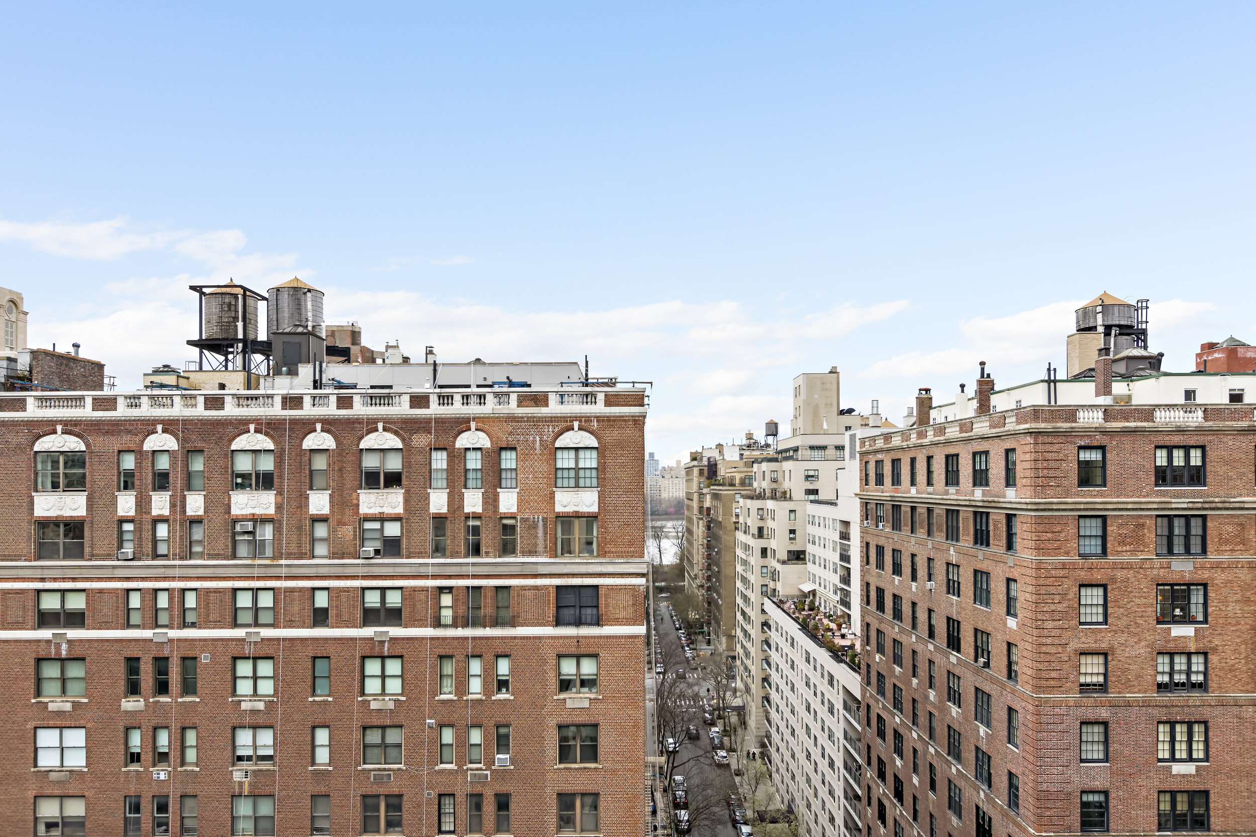 1055 Park Avenue, Unit PH Manhattan, NY 10028 - Photo 17 of 19 a view of a city that has a building