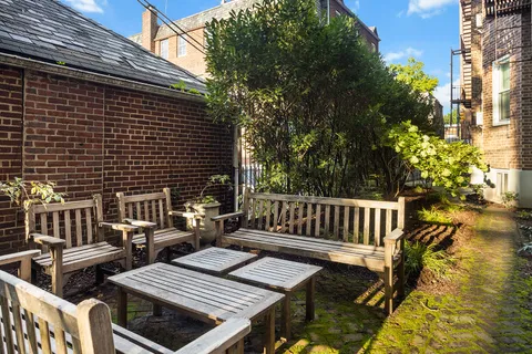 a view of a patio with two chairs