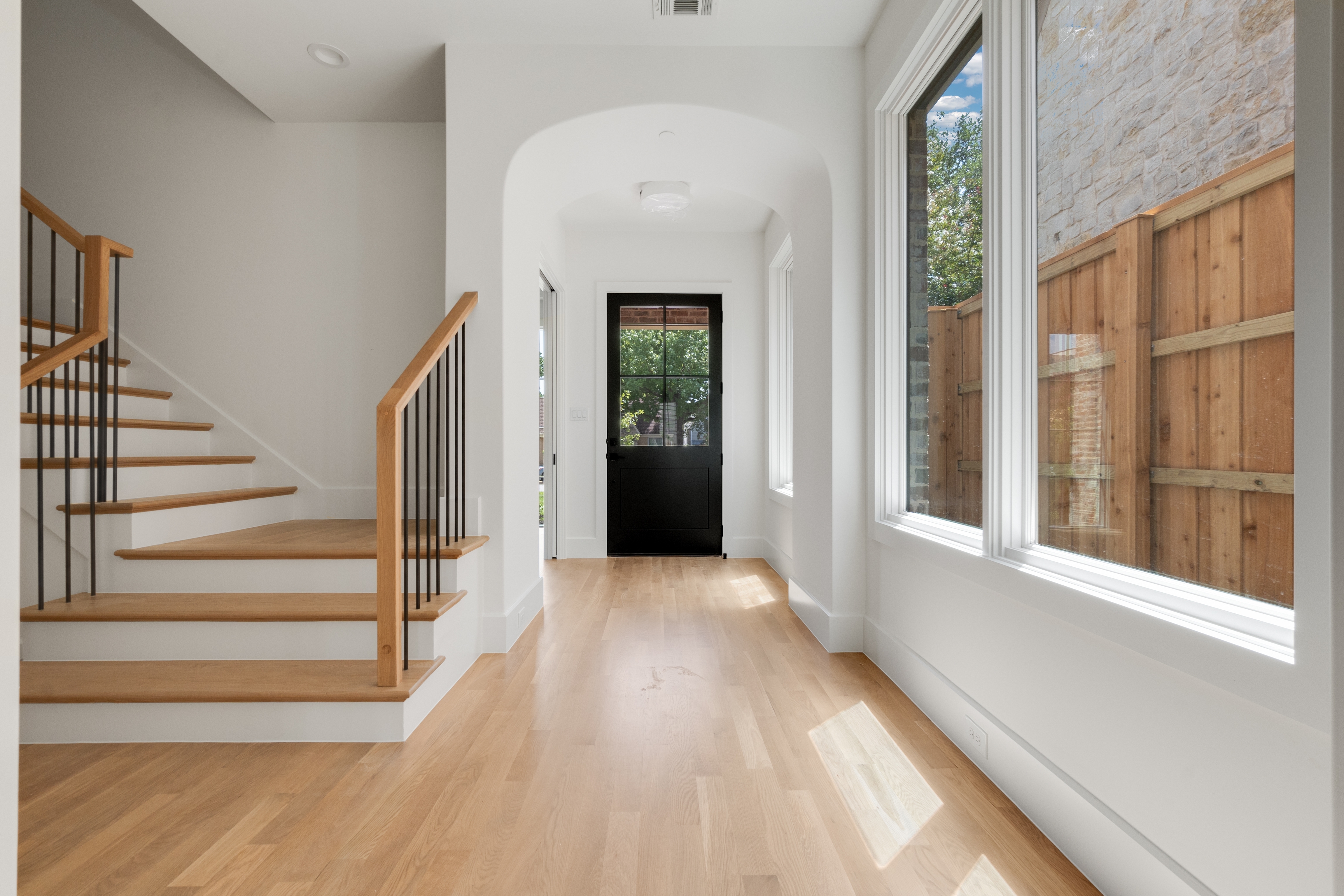 4410 Glenwick Lane Dallas, TX 75205 - Photo 13 of 28 a view of a hallway with wooden floor and staircase