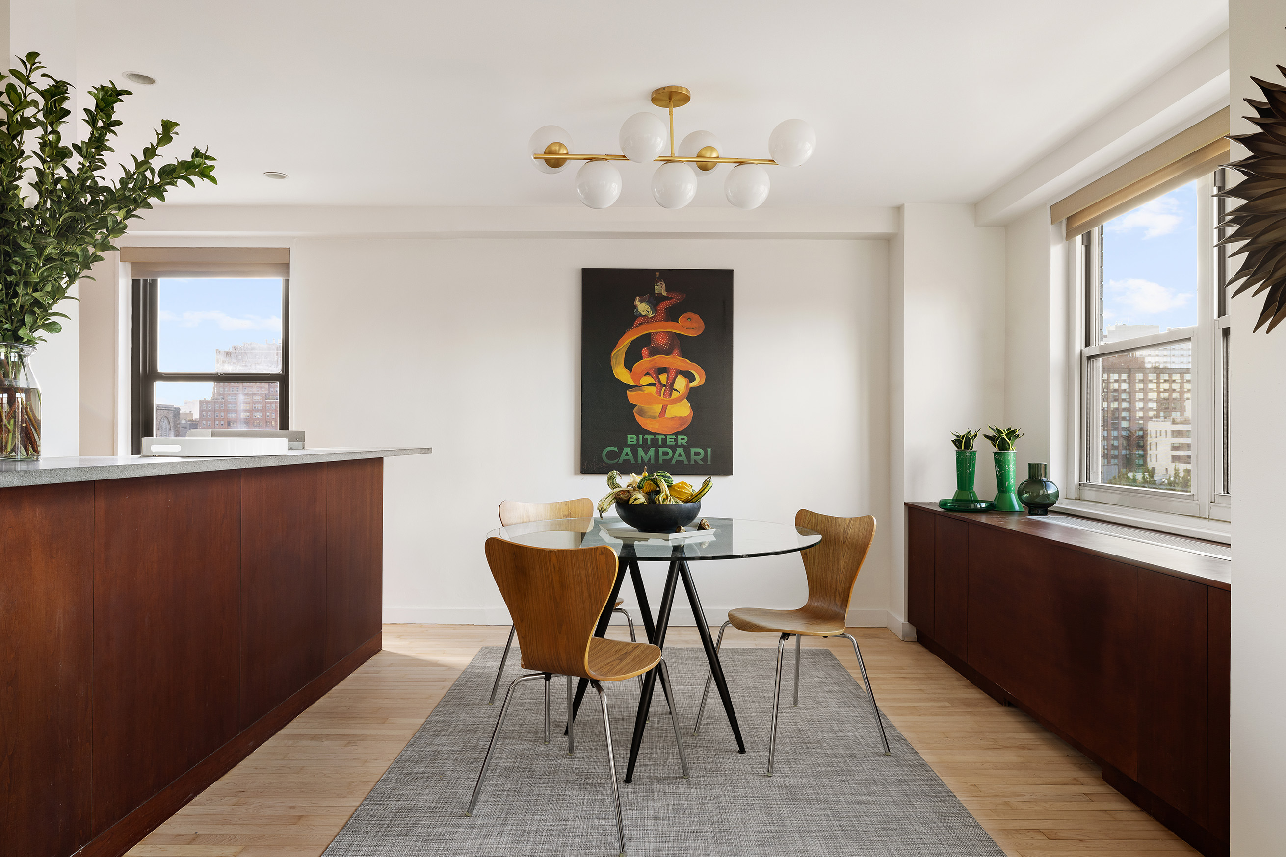 360 West 22nd Street, Unit 12B Manhattan, NY 10011 - Photo 5 of 16 a view of a dining room with furniture window and wooden floor
