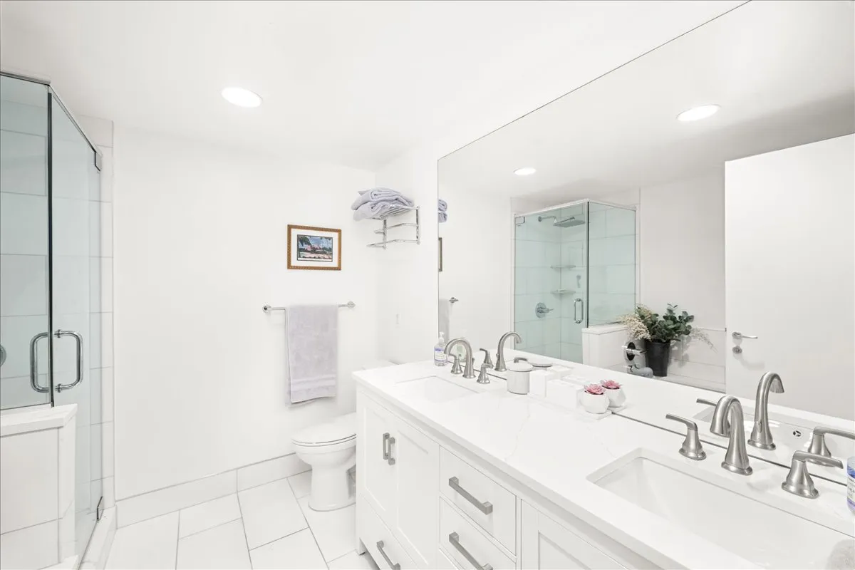a bathroom with a sink toilet and a mirror