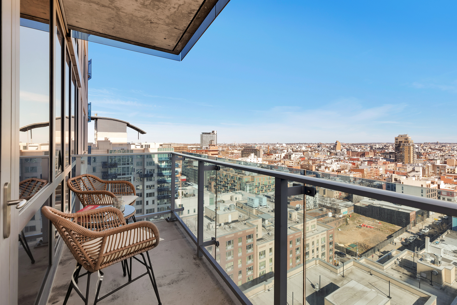 22 North 6th Street, Unit 18J Brooklyn, NY 11249 - Photo 2 of 18 a view of a balcony with chair and iron stairs