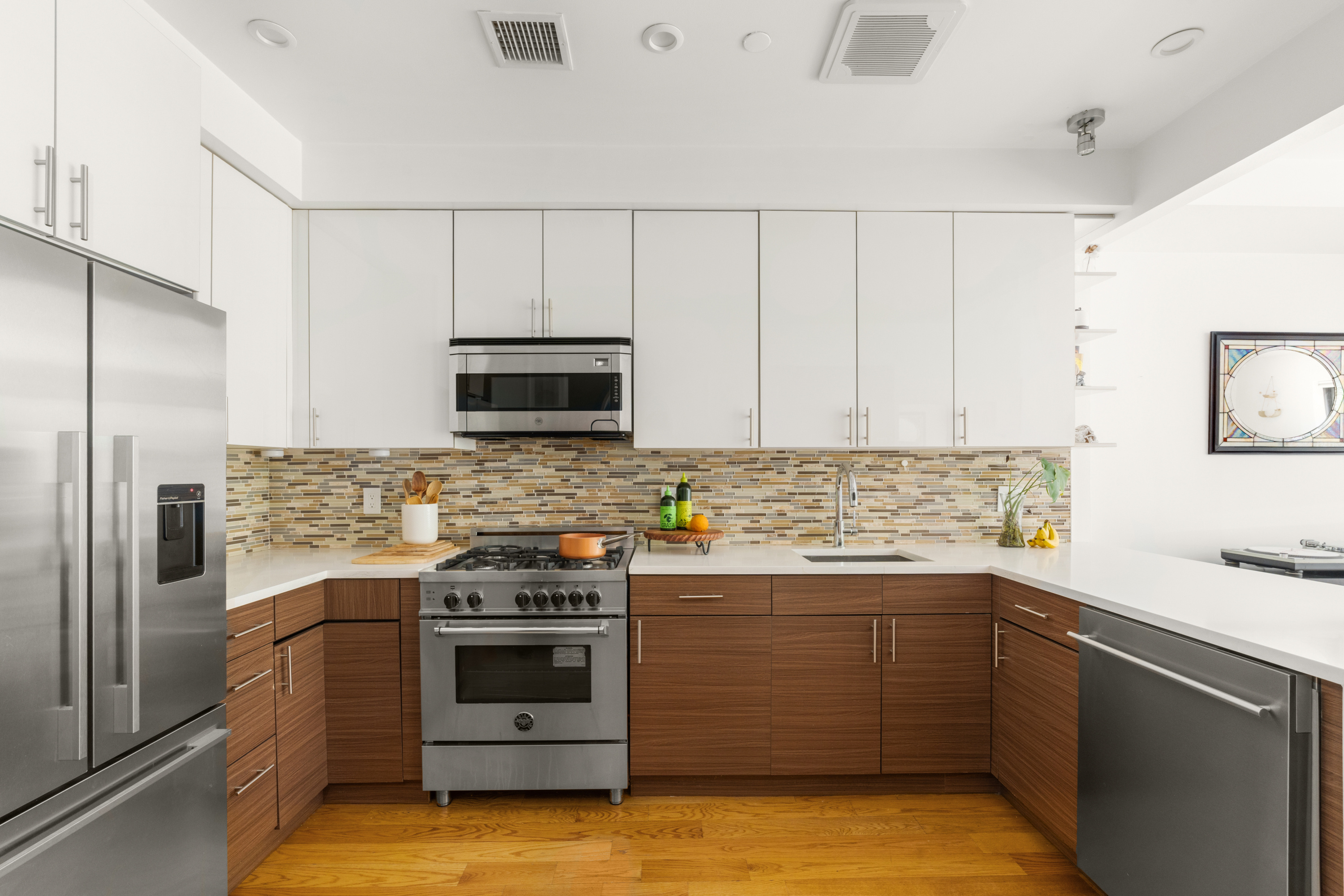 33-37 Madison Street, Unit 2B Brooklyn, NY 11238 - Photo 5 of 10 a kitchen with a sink stove and microwave
