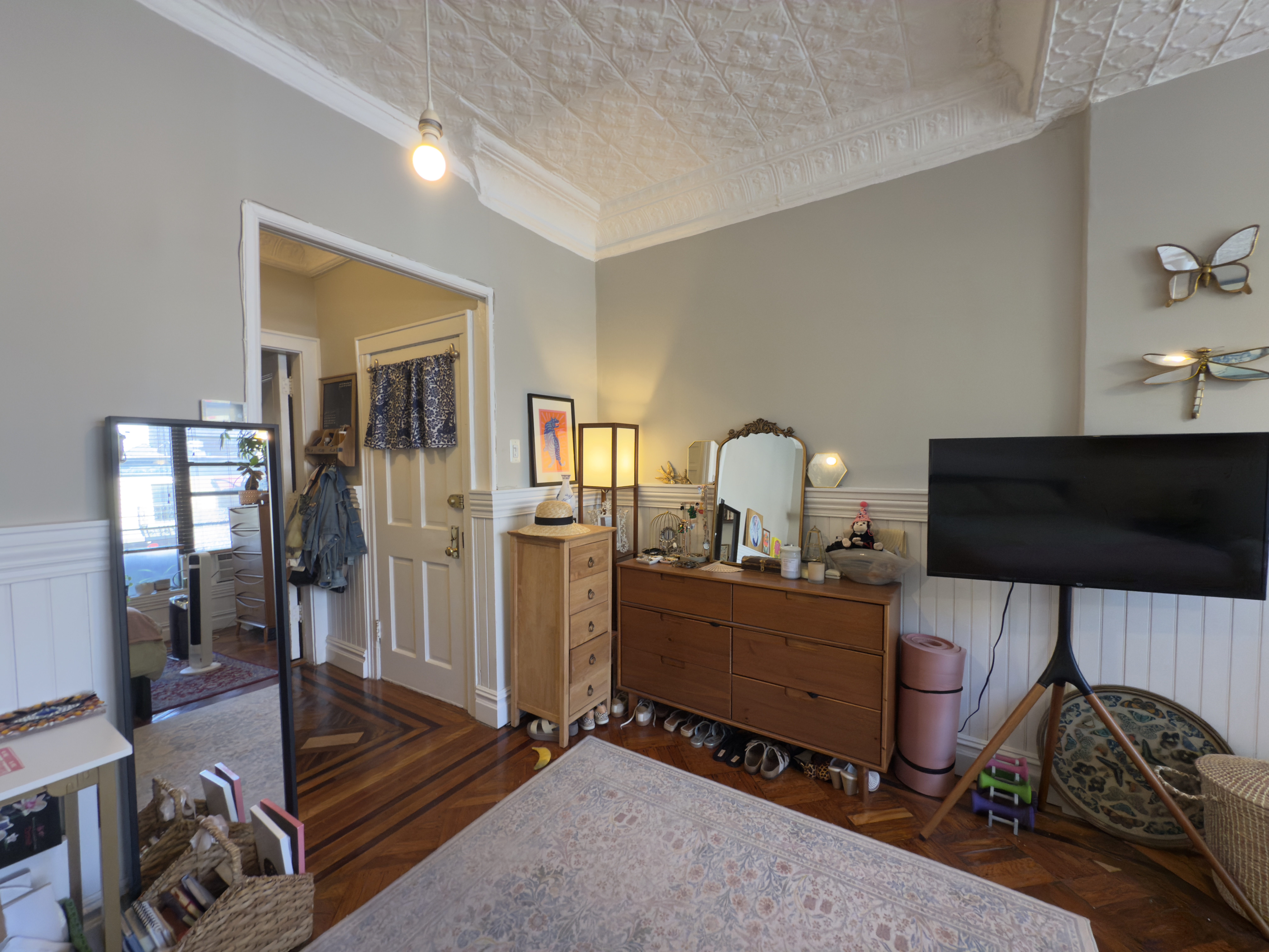 141 7th Avenue, Unit 1 Brooklyn, NY 11215 - Photo 11 of 16 a room with furniture and a flat screen tv