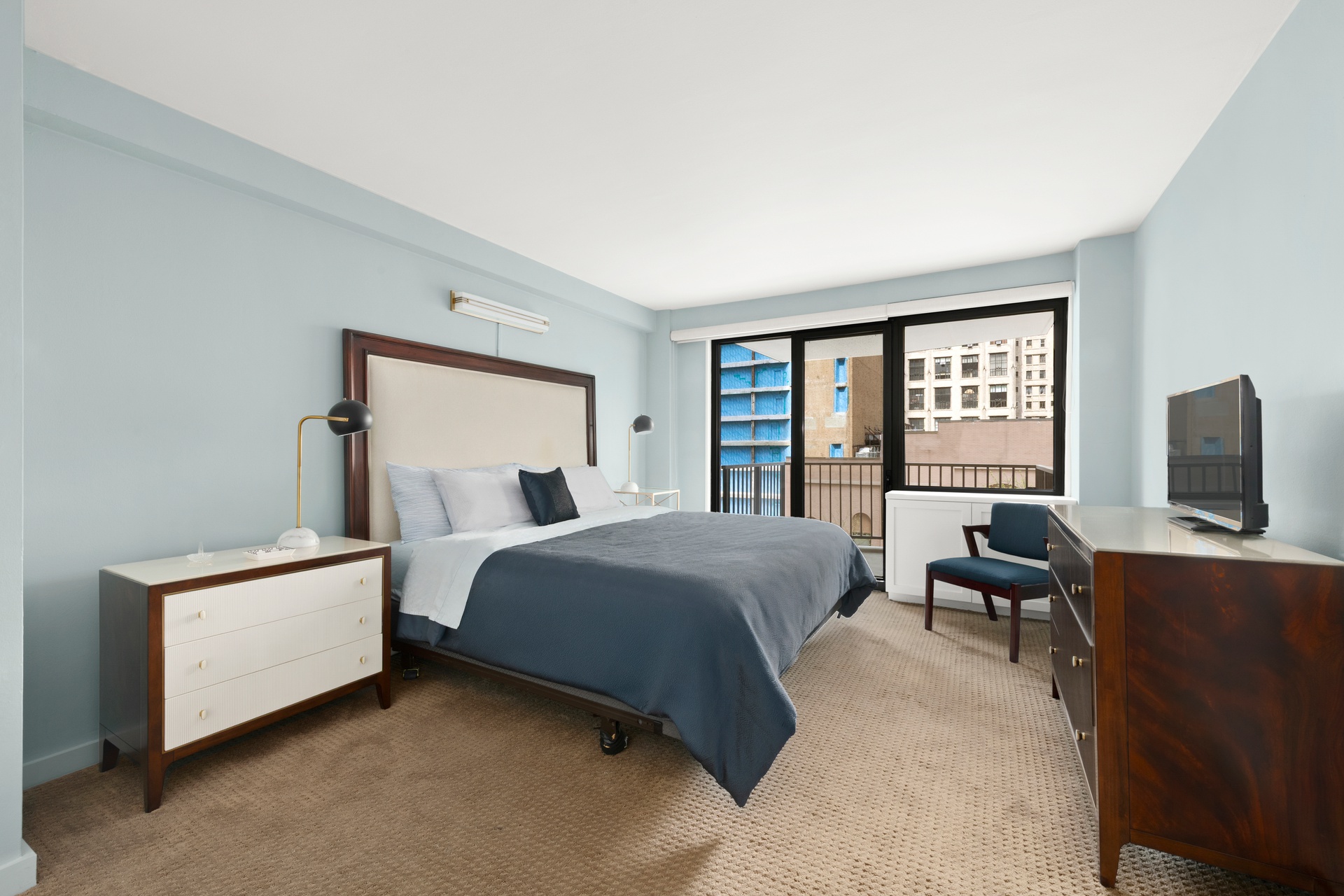 10 West 66th Street, Unit 7C Manhattan, NY 10023 - Photo 5 of 19 a bedroom with a bed and a couch