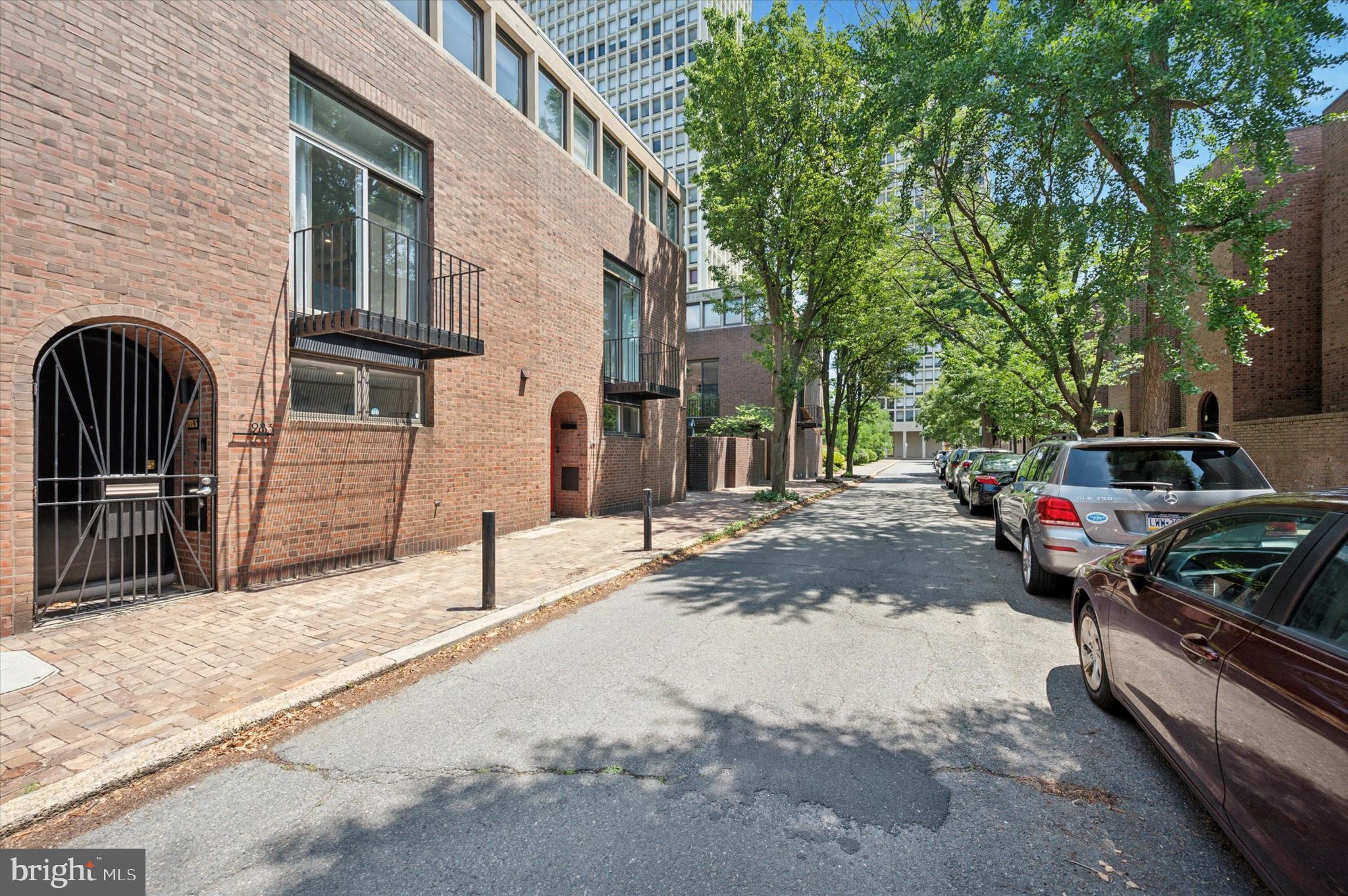 283 Locust Street Philadelphia, PA 19106 - Photo 32 of 33 a backyard of a house with barbeque oven and outdoor seating